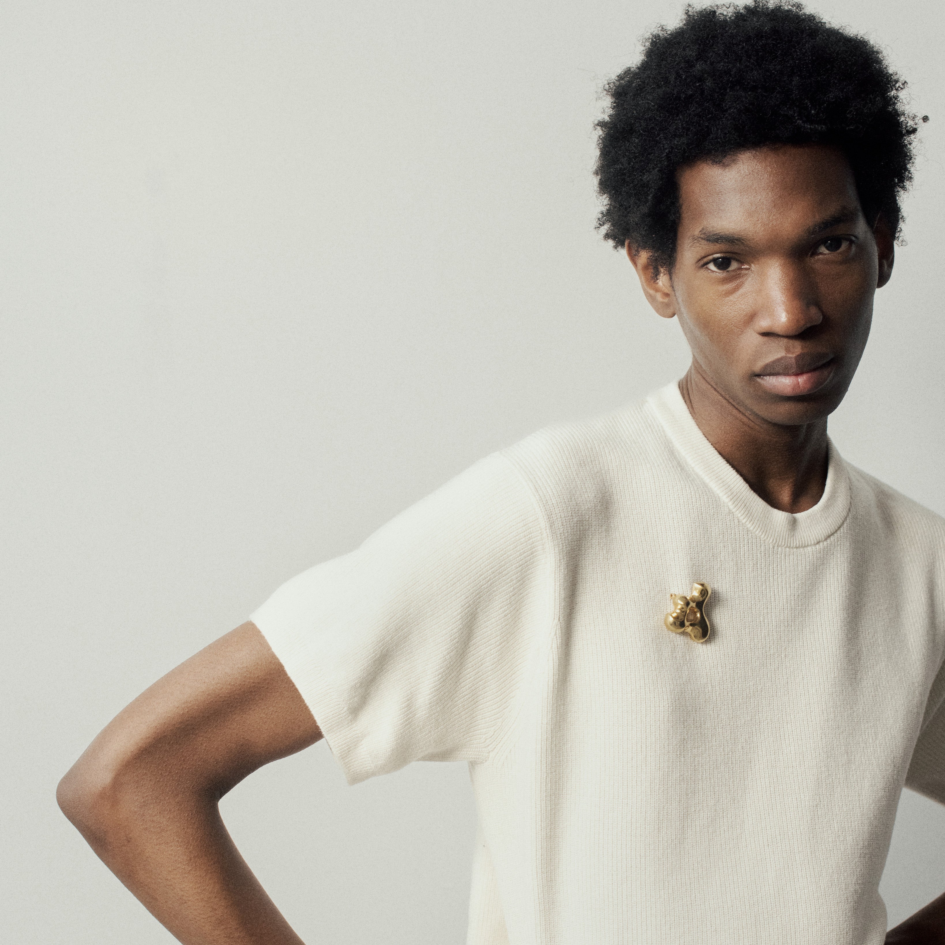 Man wearing the AGMES 18K Gold Vermeil Simone Brooch. Simone Bodmer-Turner.