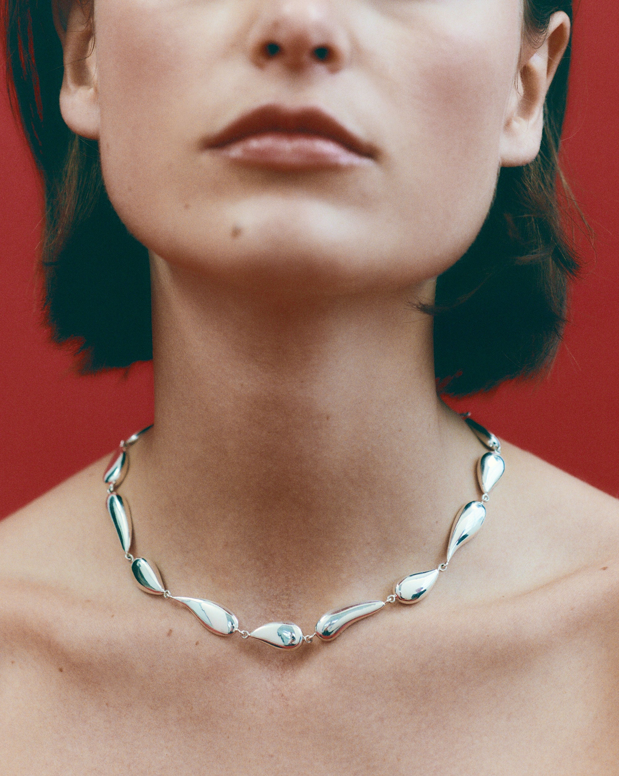 Woman wearing AGMES 0.925 Sterling Silver Ila Necklace.