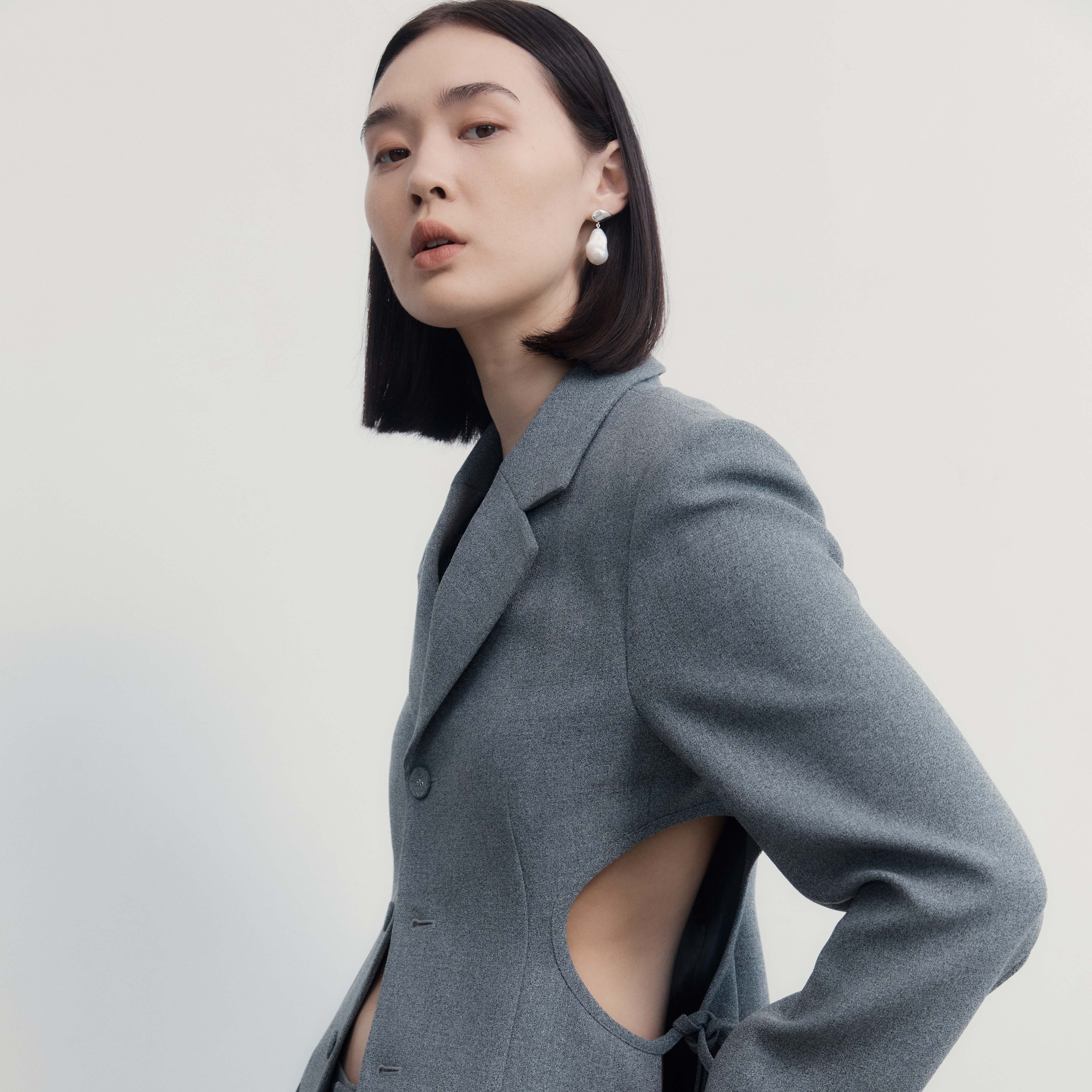 Woman wearing AGMES .925 Sterling Silver Ila Earrings with Baroque Pearl Drop.