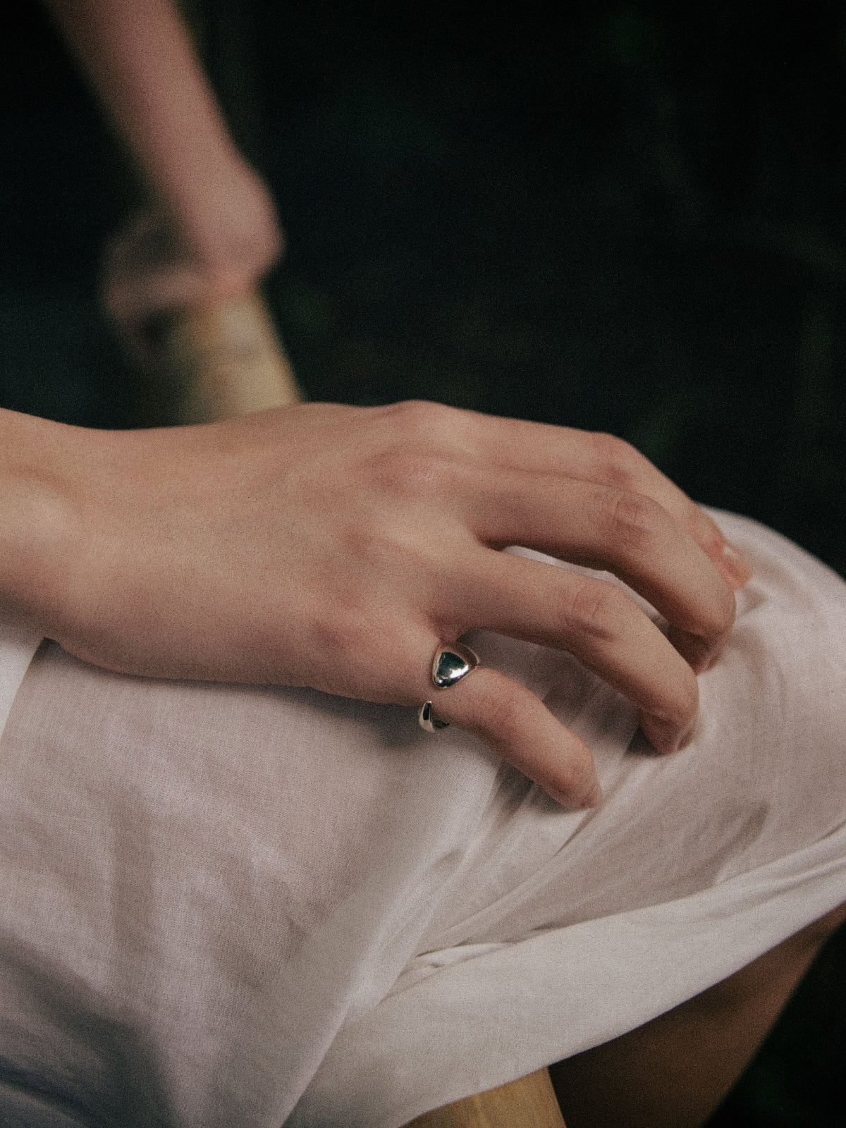 Hand wearing AGMES 0.925 sterling silver mini cuff Sienna Ring.
