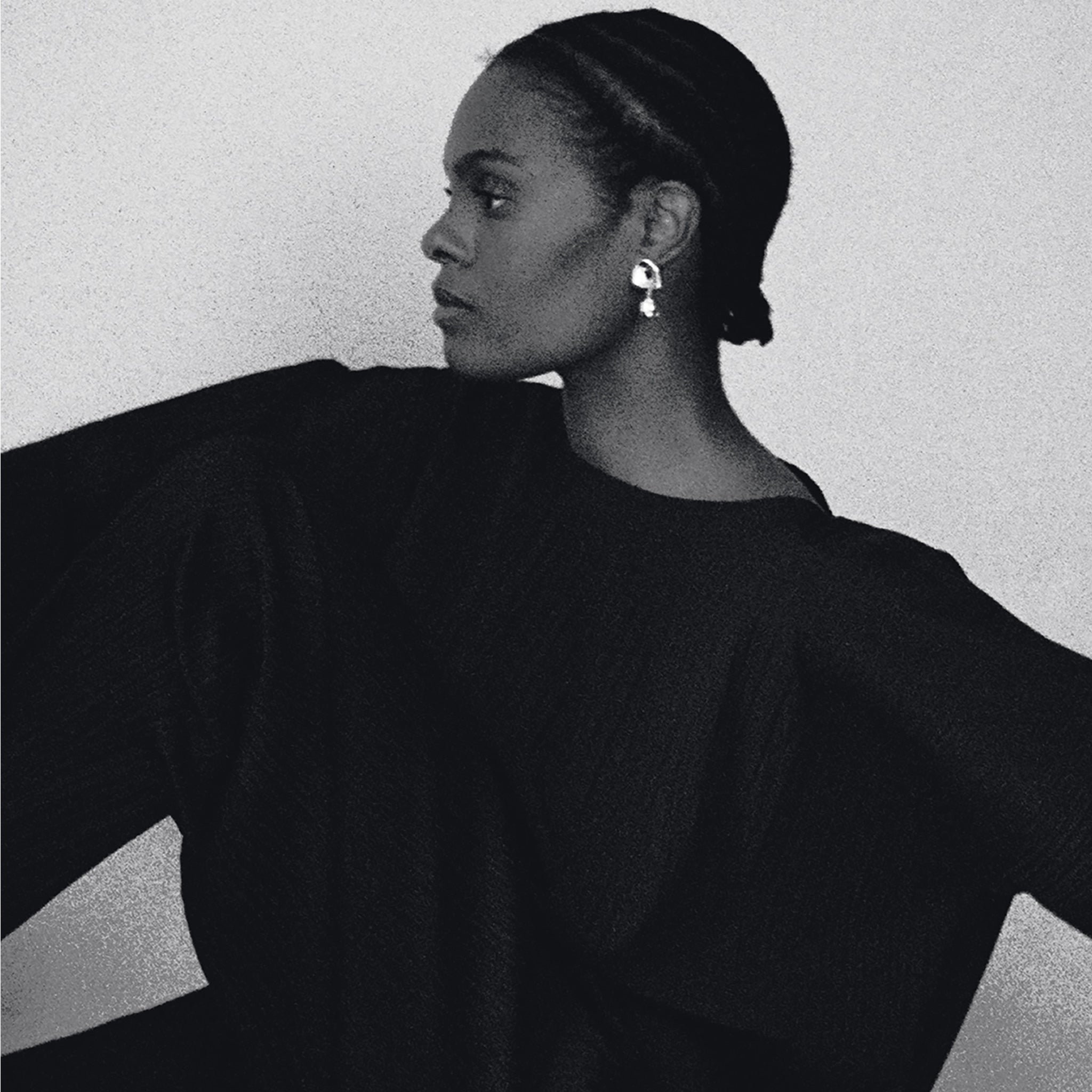 Woman wearing the AGMES .925 Sterling Silver Sandra Clip-on Earrings with Freshwater Pearl drop.