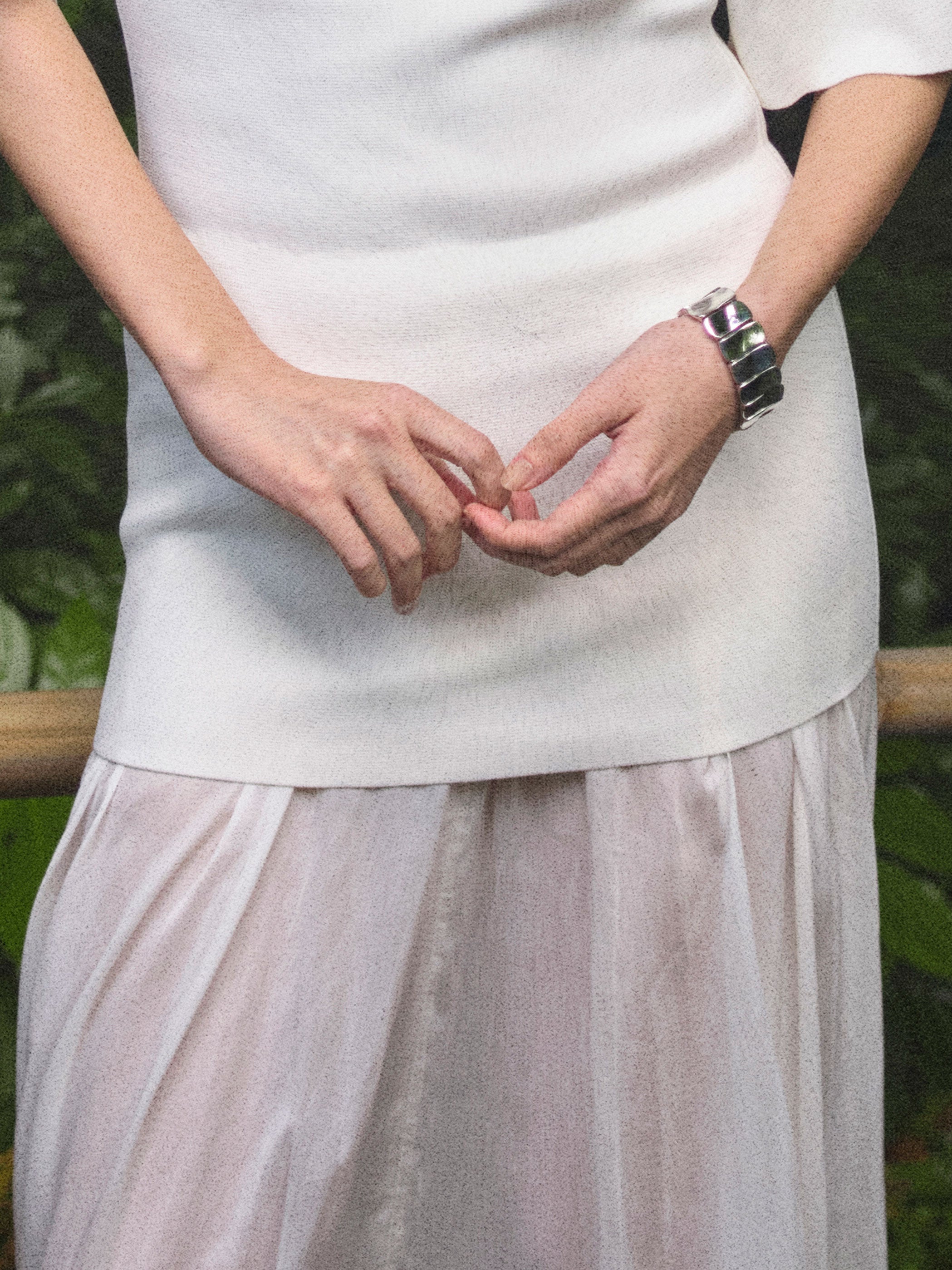 Person wearing AGMES .925 sterling silver sculptural Short Ilona Bracelet.