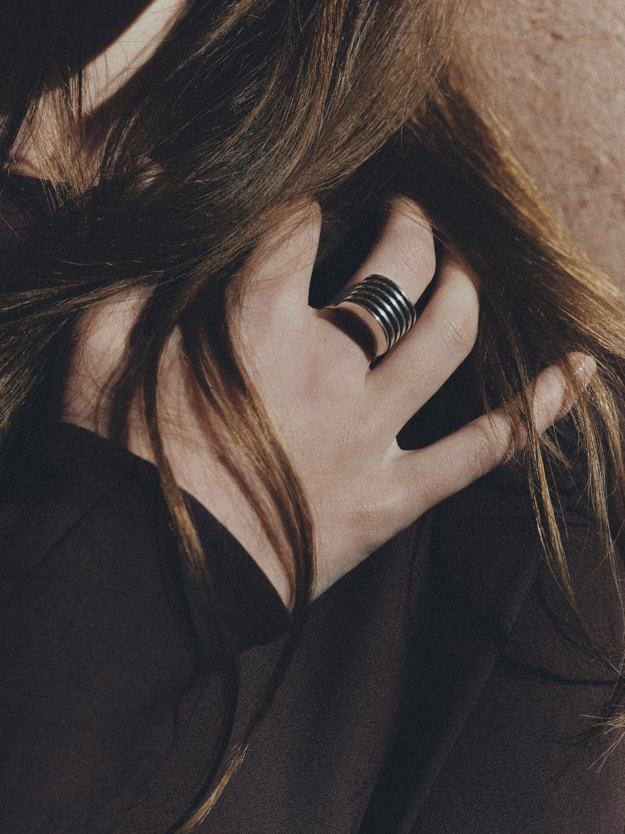 Hand wearing AGMES .925 Sterling Silver Wide Boeri Ring.