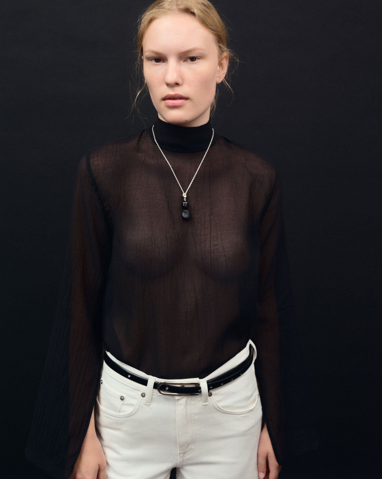 Black Onyx beaded pendant drop necklace on sterling silver chain on woman's neck