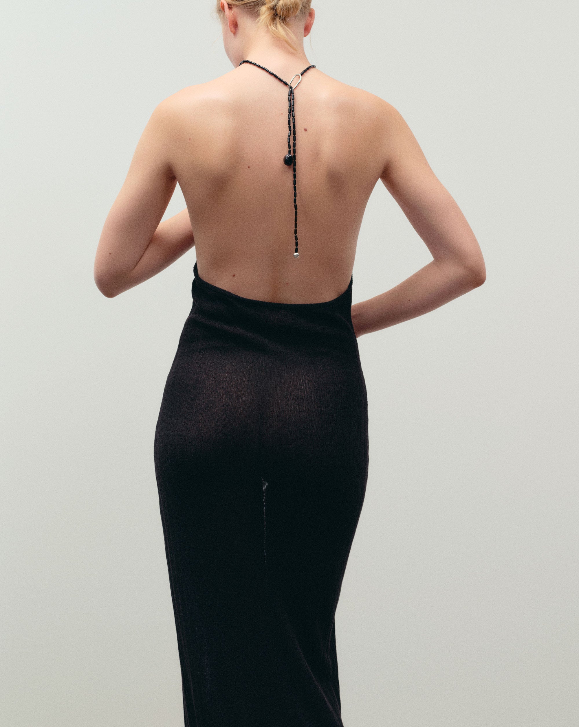 Black Onyx beaded lasso lariat style necklace with sterling silver accents worn hanging down model's back