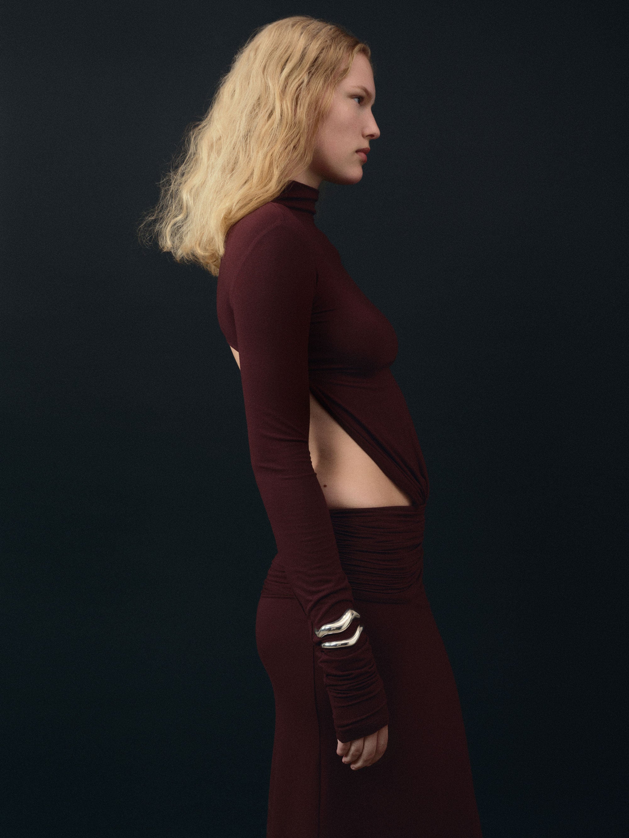 Woman wearing AGMES 0.925 sterling silver abstract medium and large Astrid cuff set.