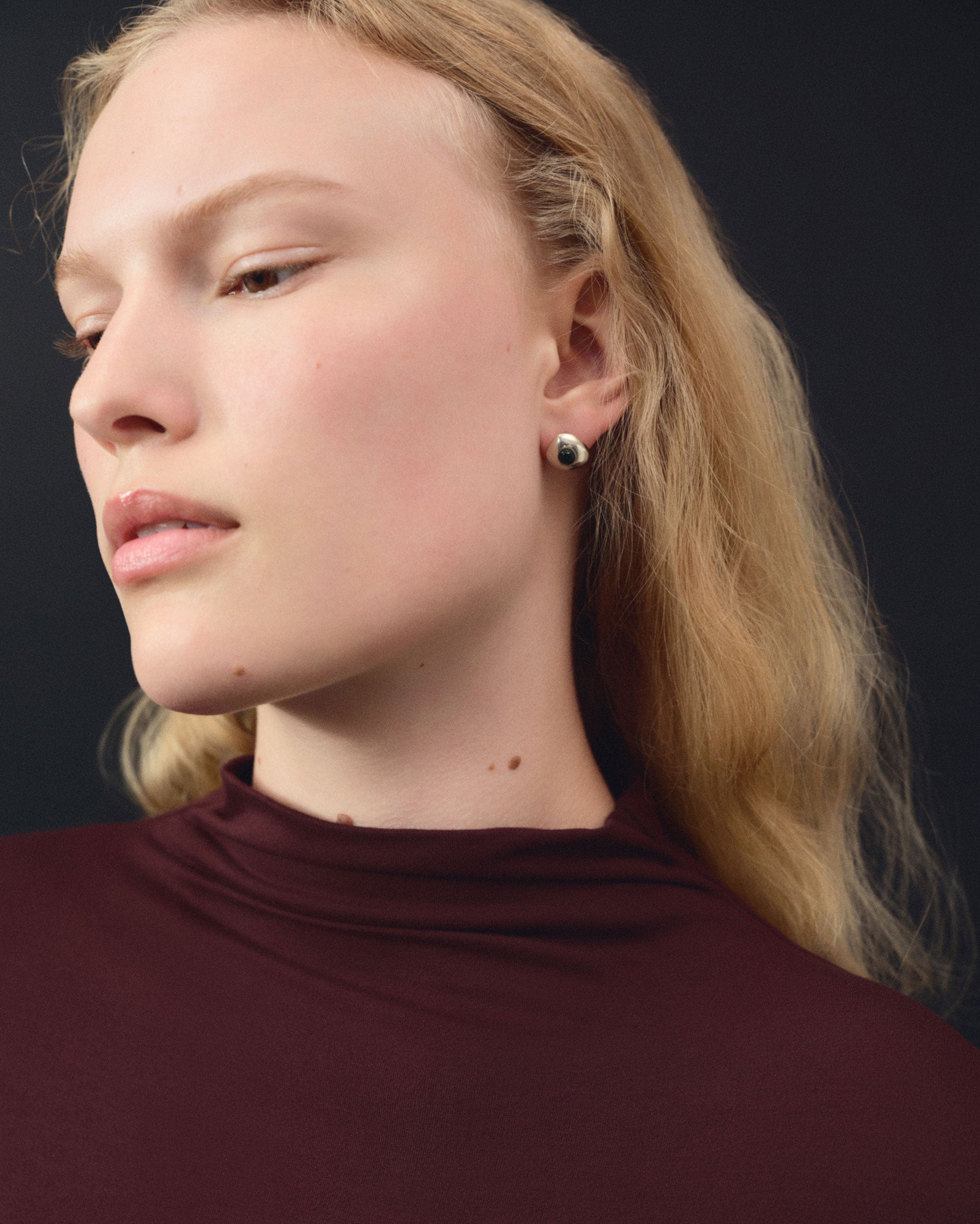 Women wearing AGMES 0.925 sterling silver stud earrings with onyx.