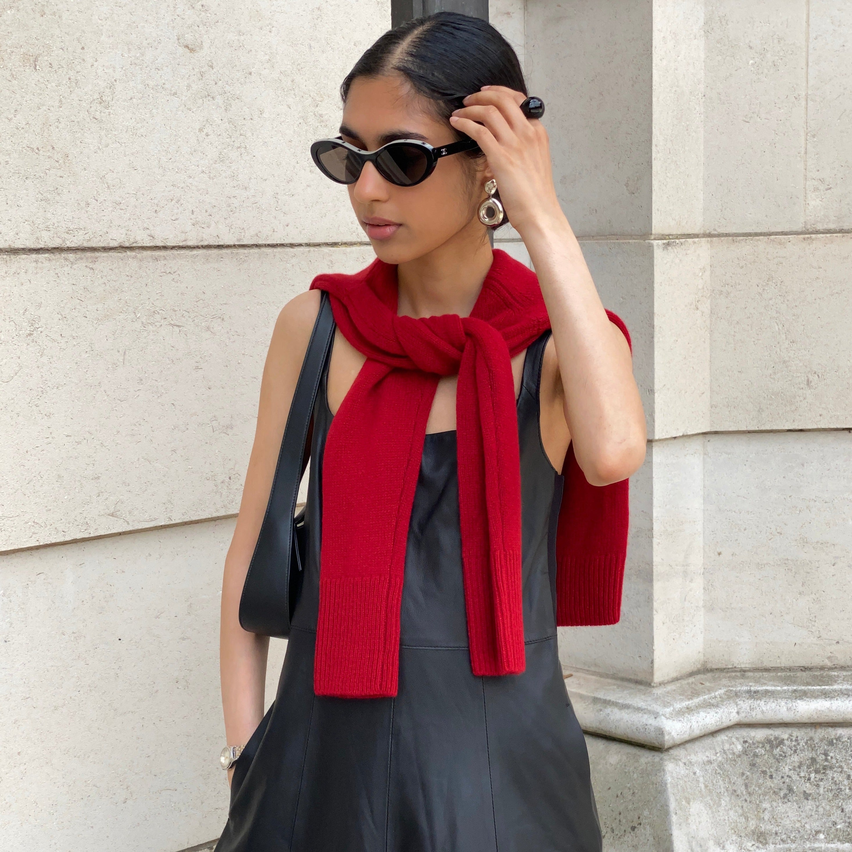 Woman wearing AGMES 0.925 sterling silver earrings with silver drop donut ring.