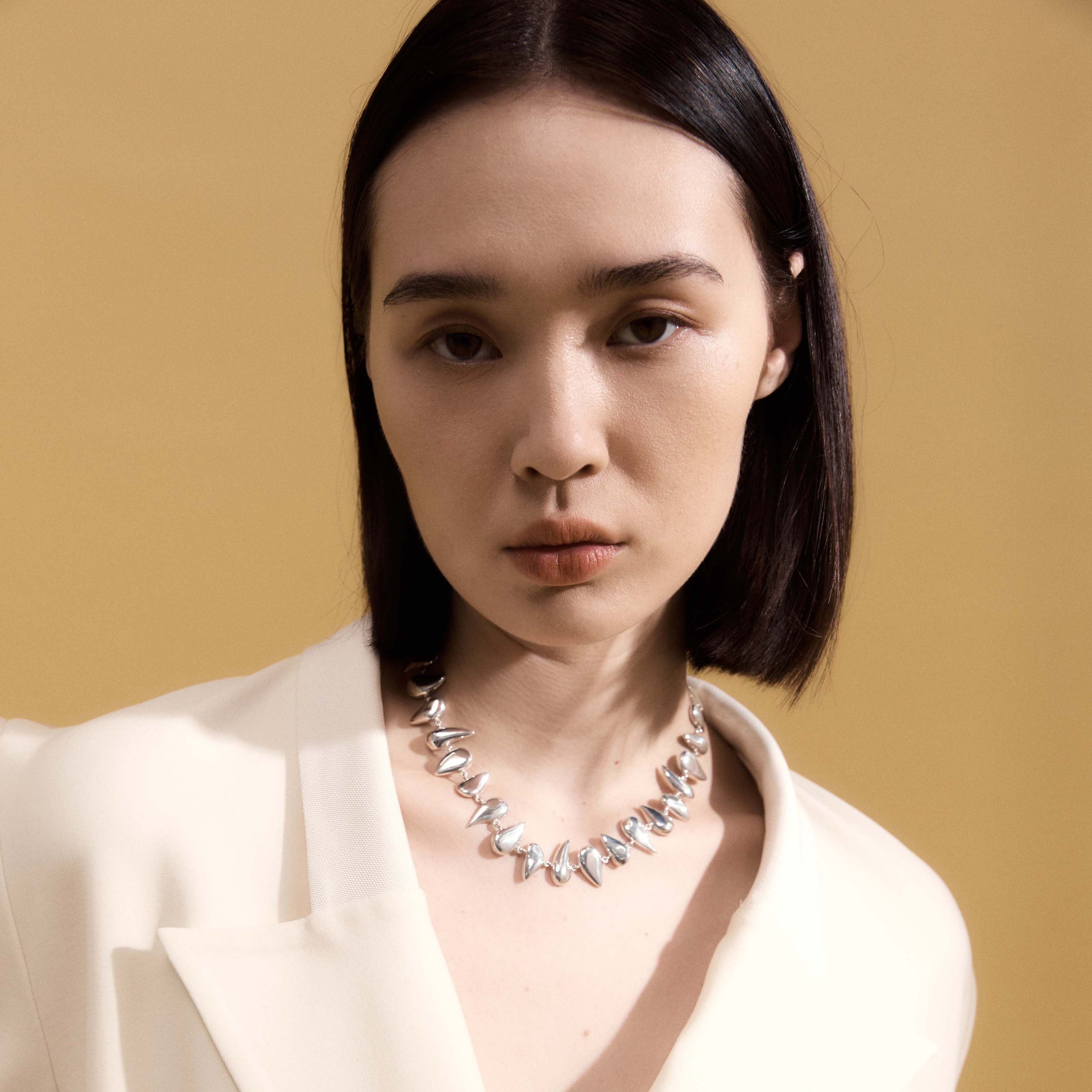 Woman wearing AGMES 0.925 Sterling Silver Flora Necklace.