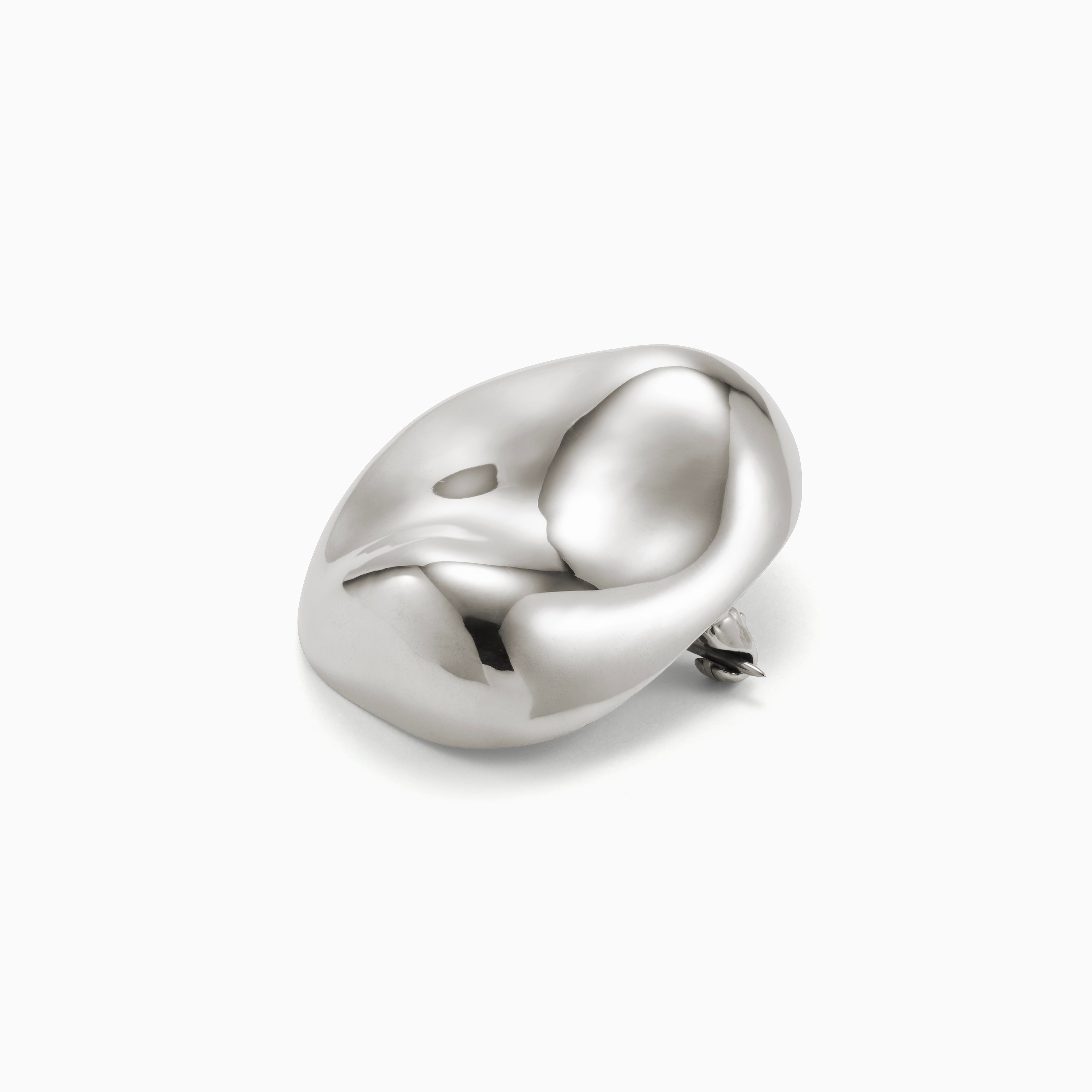 AGMES 0.925 sterling silver round naturally shaped Gia Brooch on white background.
