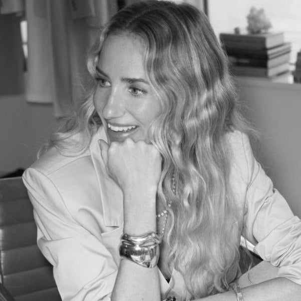 Woman wearing the AGMES .925 Sterling Silver Jean Cuff and Large Astrid Cuff Set.