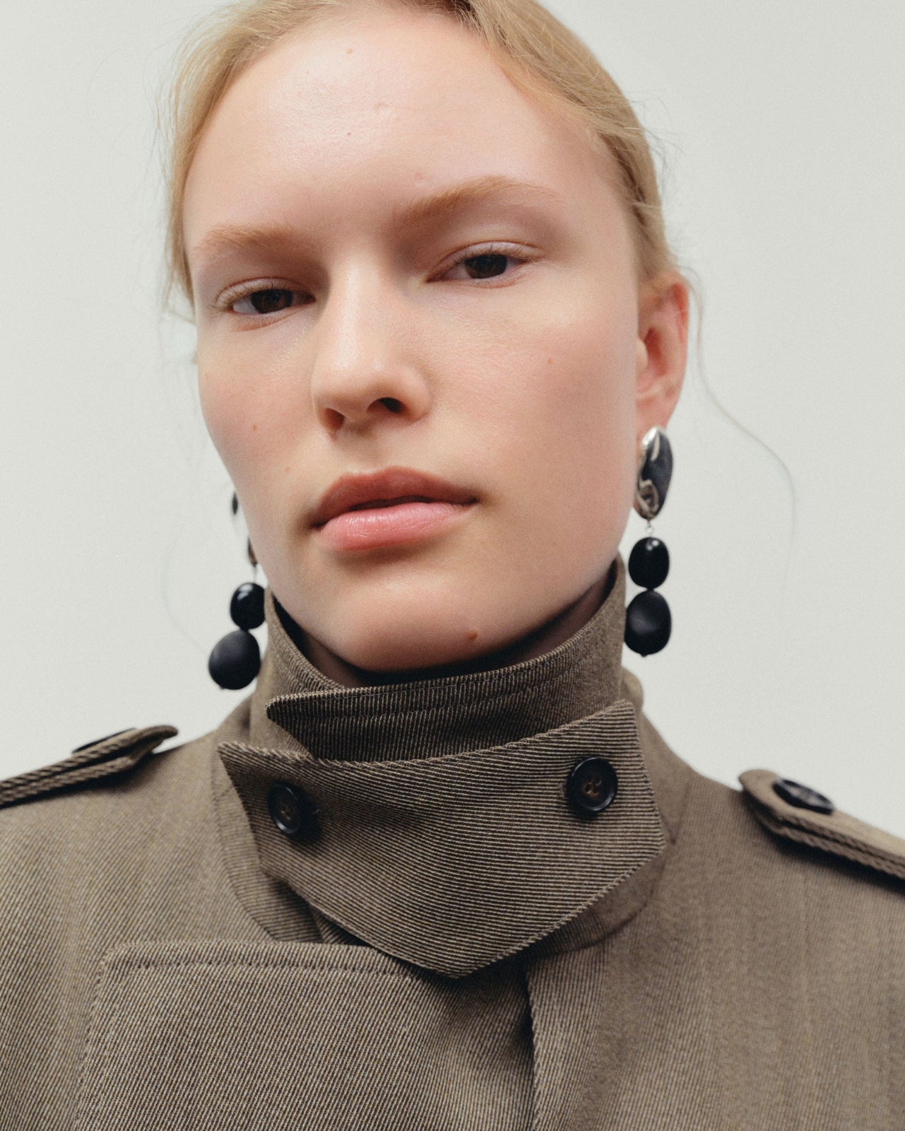 .925 sterling silver oval shaped earrings with double black onyx bead drop on model