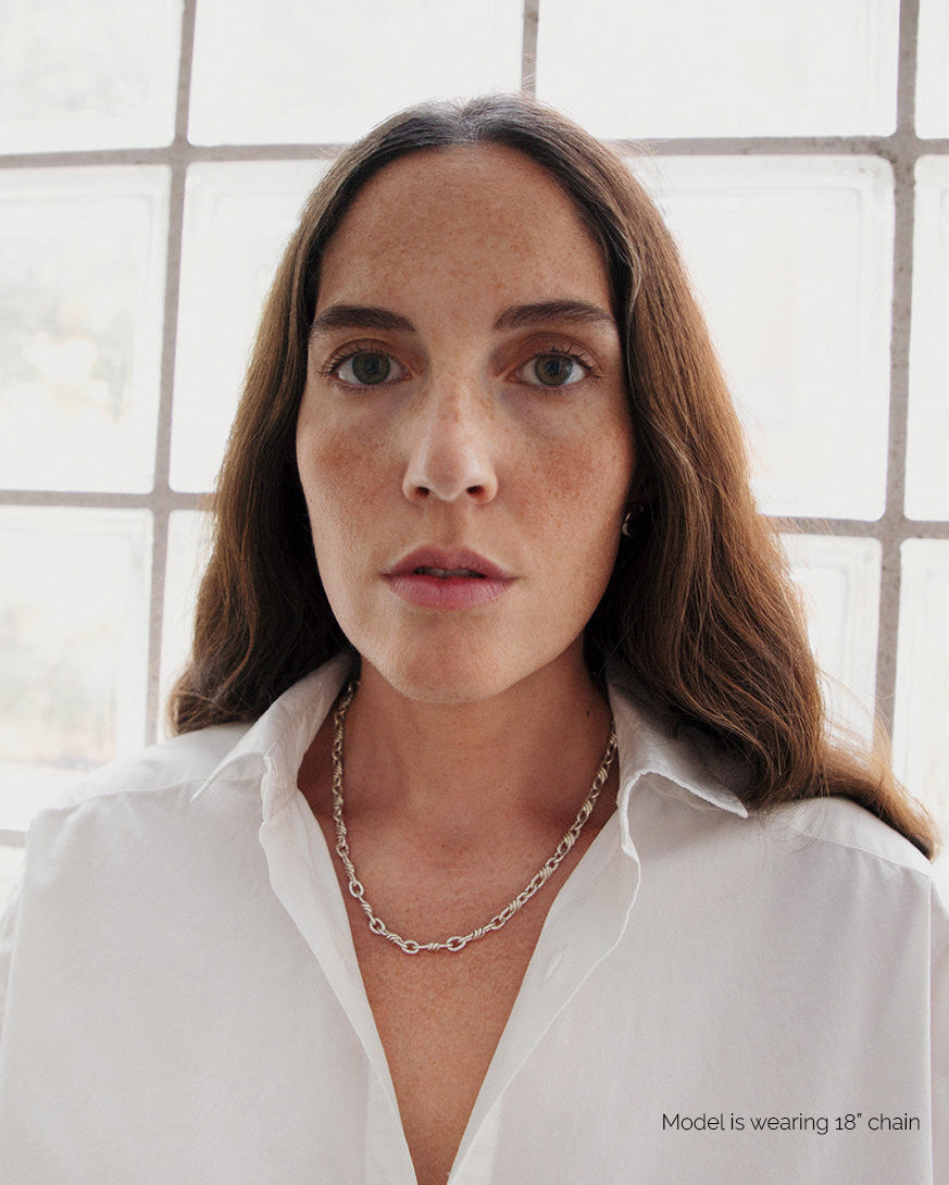 Model wearing AGMES .925 sterling silver 18 inch mixed rope Theo Chain Necklace with sculptural AGMES T-bar clasp with white blouse.