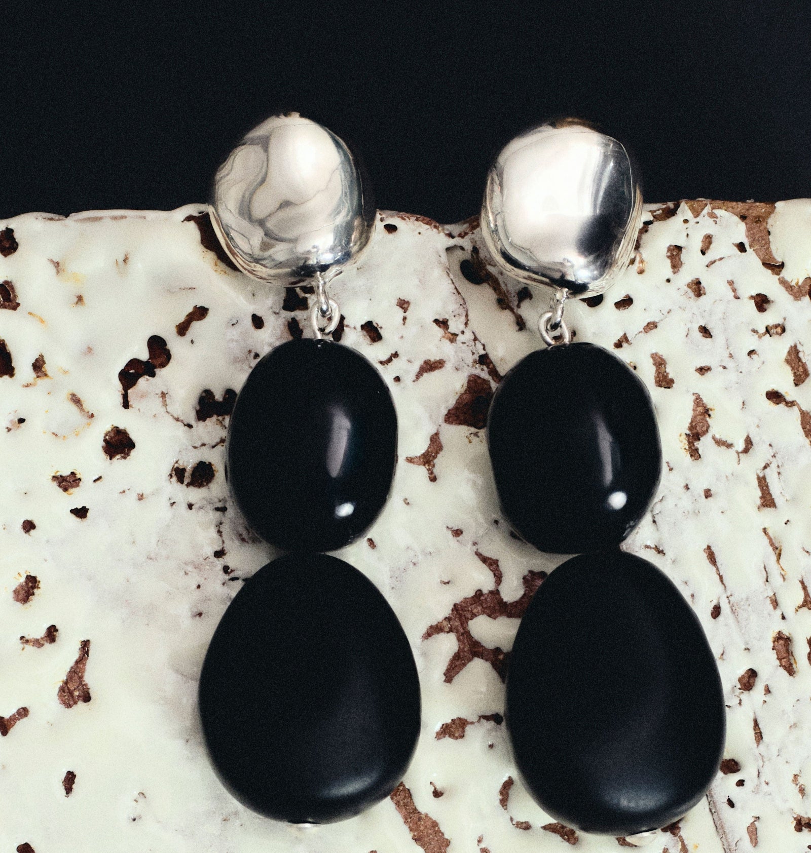 AGMES .925 sterling silver round earrings with double black onyx bead drop on natural background