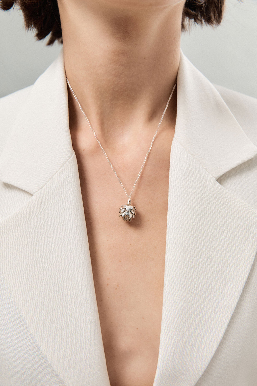 Person wearing AGMES 0.925 Sterling Silver Mini Artichoke Pendant Necklace