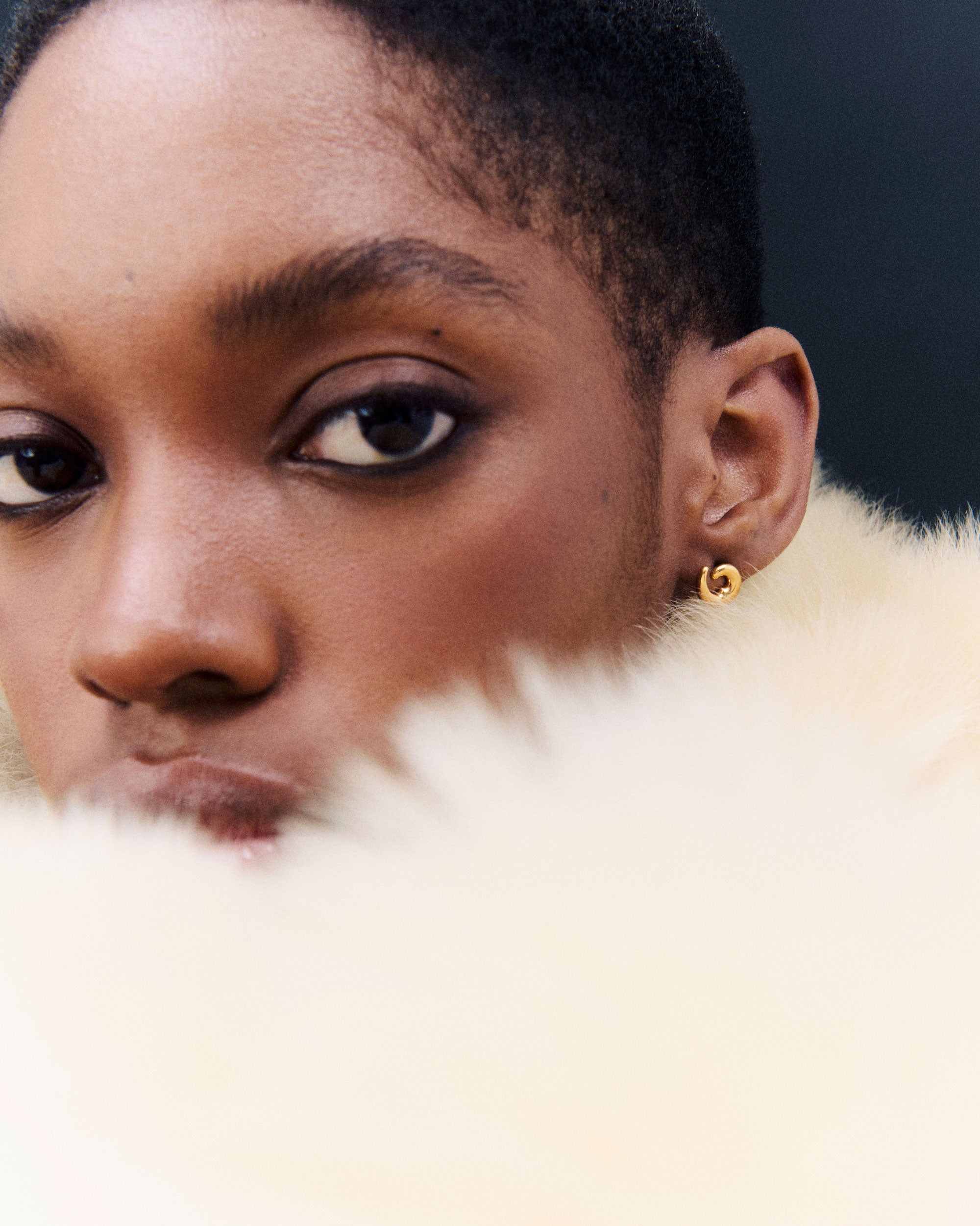 Model wearing AGMES Mini Nadia Studs in 18k Gold Vermeil