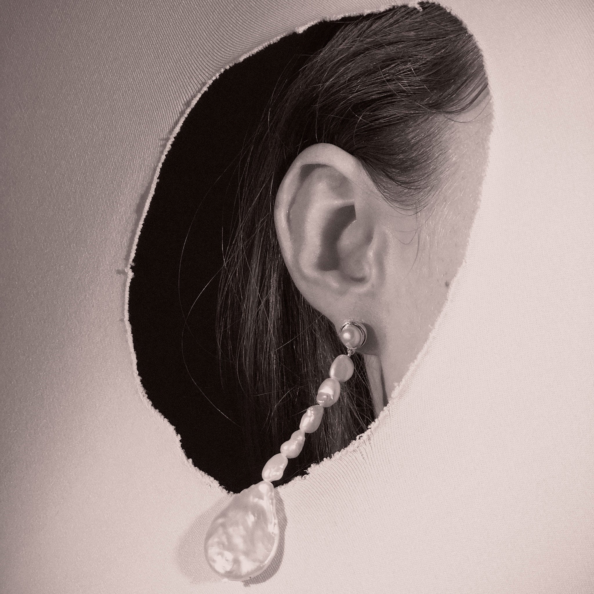 Woman wearing AGMES Emmanuelle earrings in 0.925 sterling silver with freshwater pearls.