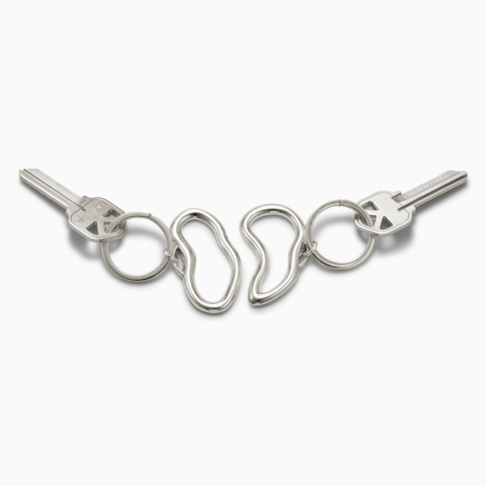 AGMES .925 sterling silver sculptural heart Sum of Parts Keychain set on white background.
