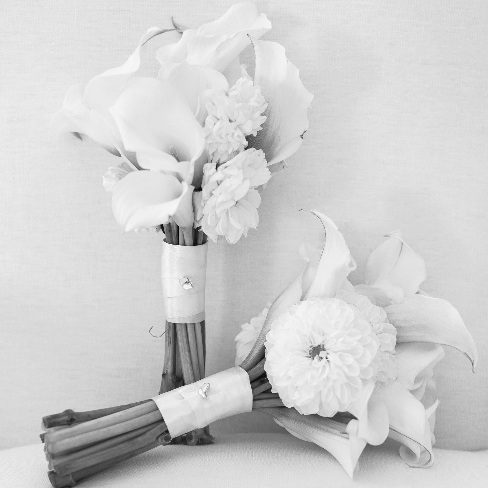 AGMES .925 Sterling Silver Sum of Parts Brooch displayed on flower bouquet.