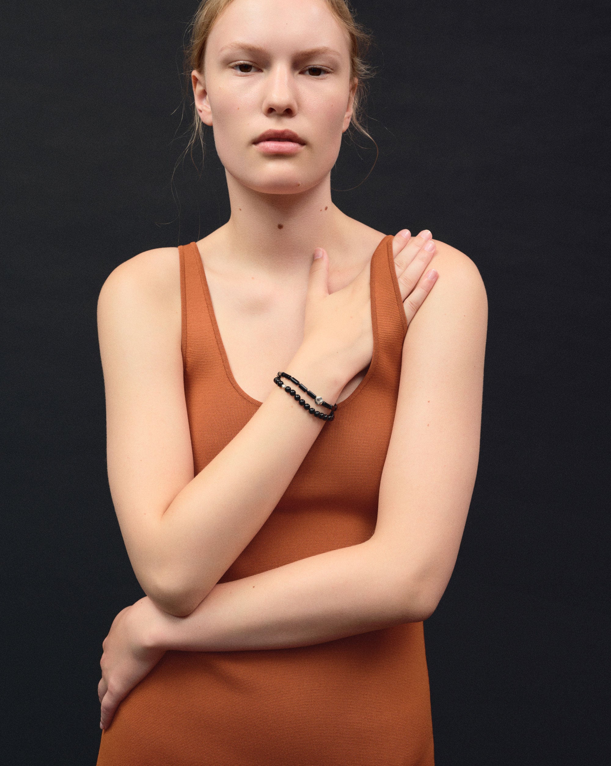 Black onyx double strand beaded bracelet with .925 sterling silver accents on woman's wrist