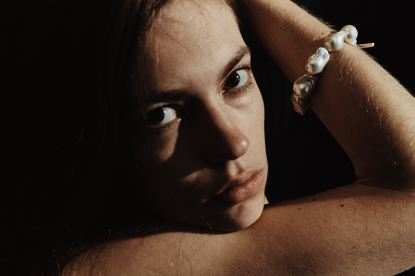 Model wearing AGMES .925 sterling silver and baroque freshwater pearl bracelet.