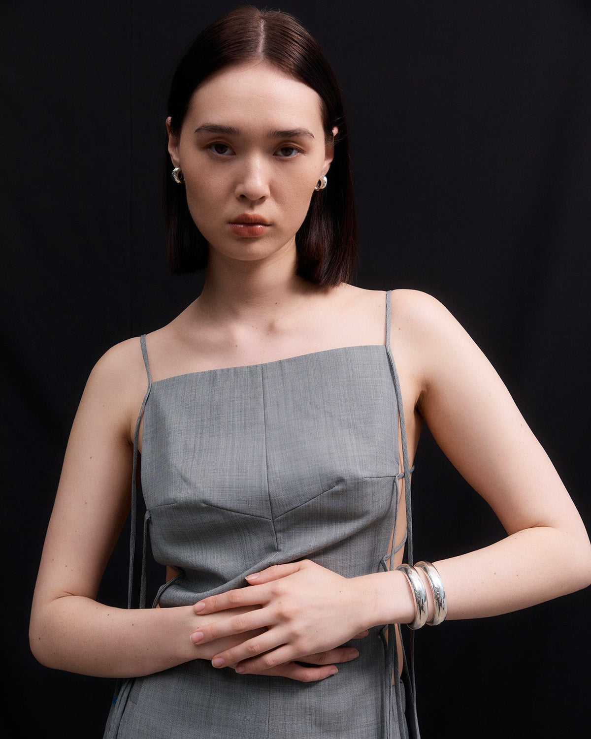 Woman wearing AGMES 0.925 Sterling Silver Charlotte Cuff and Small Celia Earrings