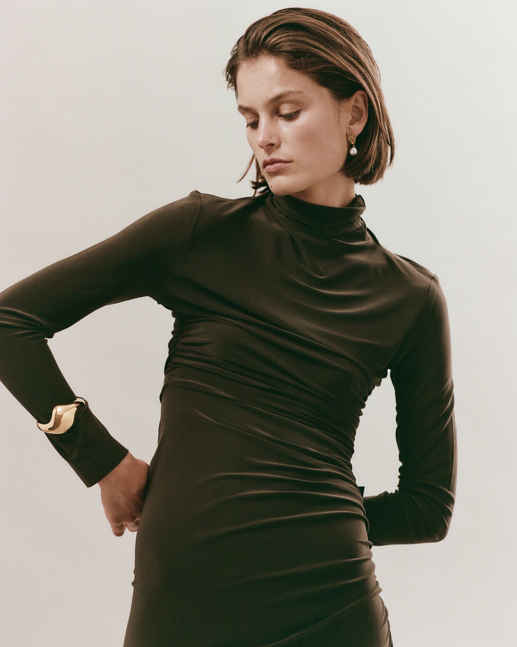 Woman elegantly wearing AGMES 18k Gold Vermeil Claudia Cuff Big Curved Bracelet Cuff