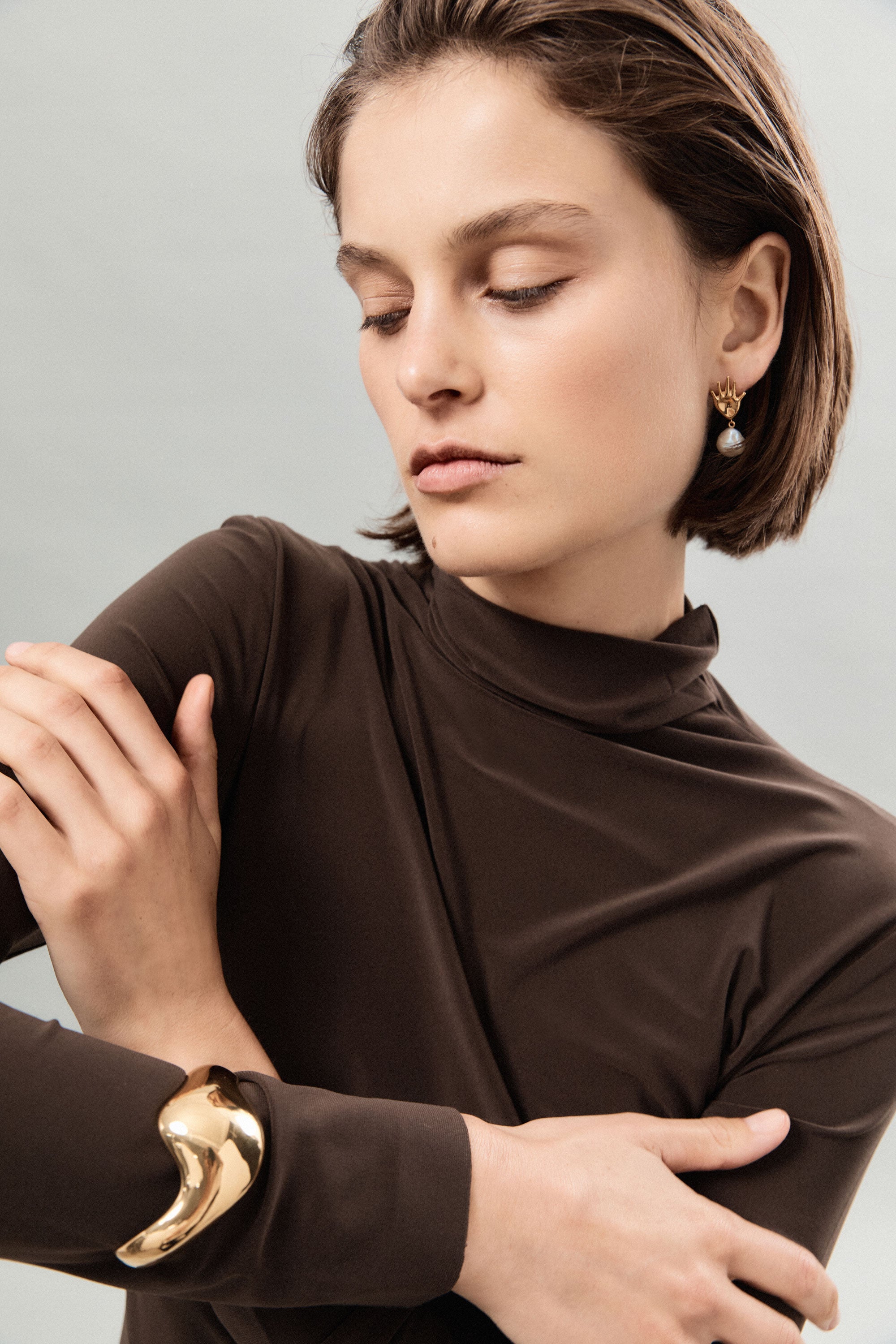 Woman wearing AGMES 18k Gold Vermeil Claudia Cuff Big Curved Bracelet