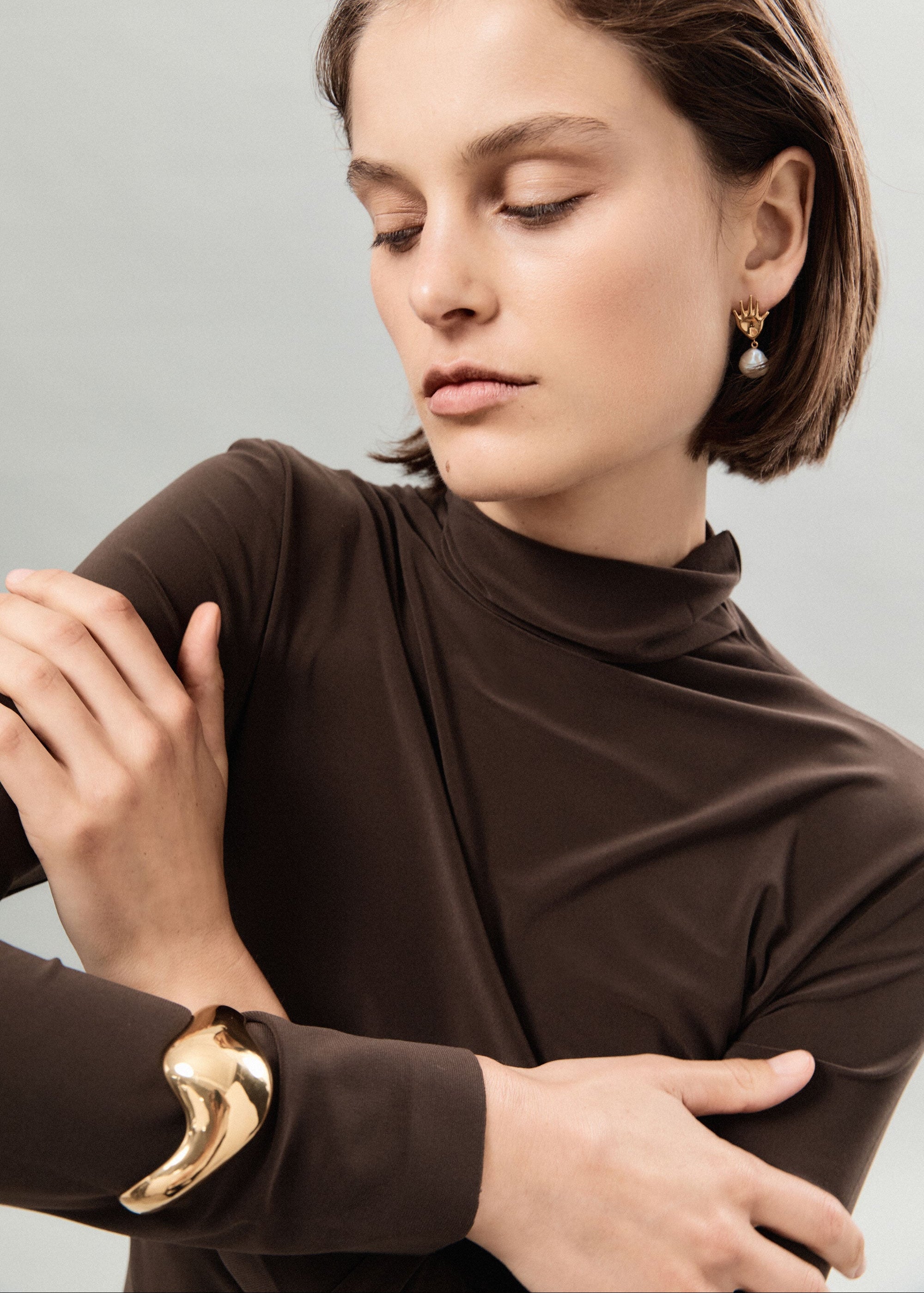 Woman wearing AGMES 18k Gold Vermeil Claudia Cuff Big Curved Bracelet