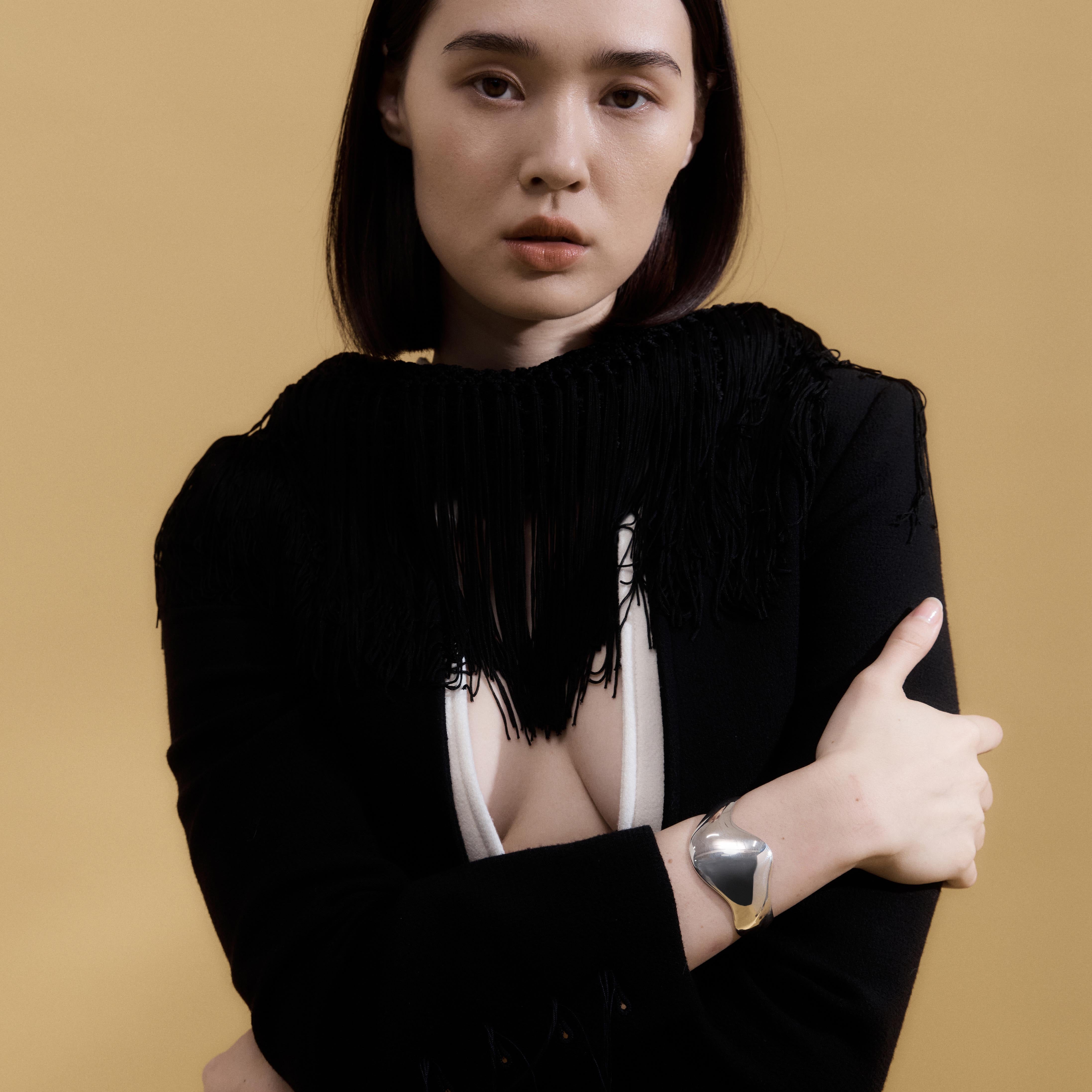 Woman wearing AGMES 0.925 sterling silver Claudia Cuff Curved Modern Sculptural Bracelet Cuff