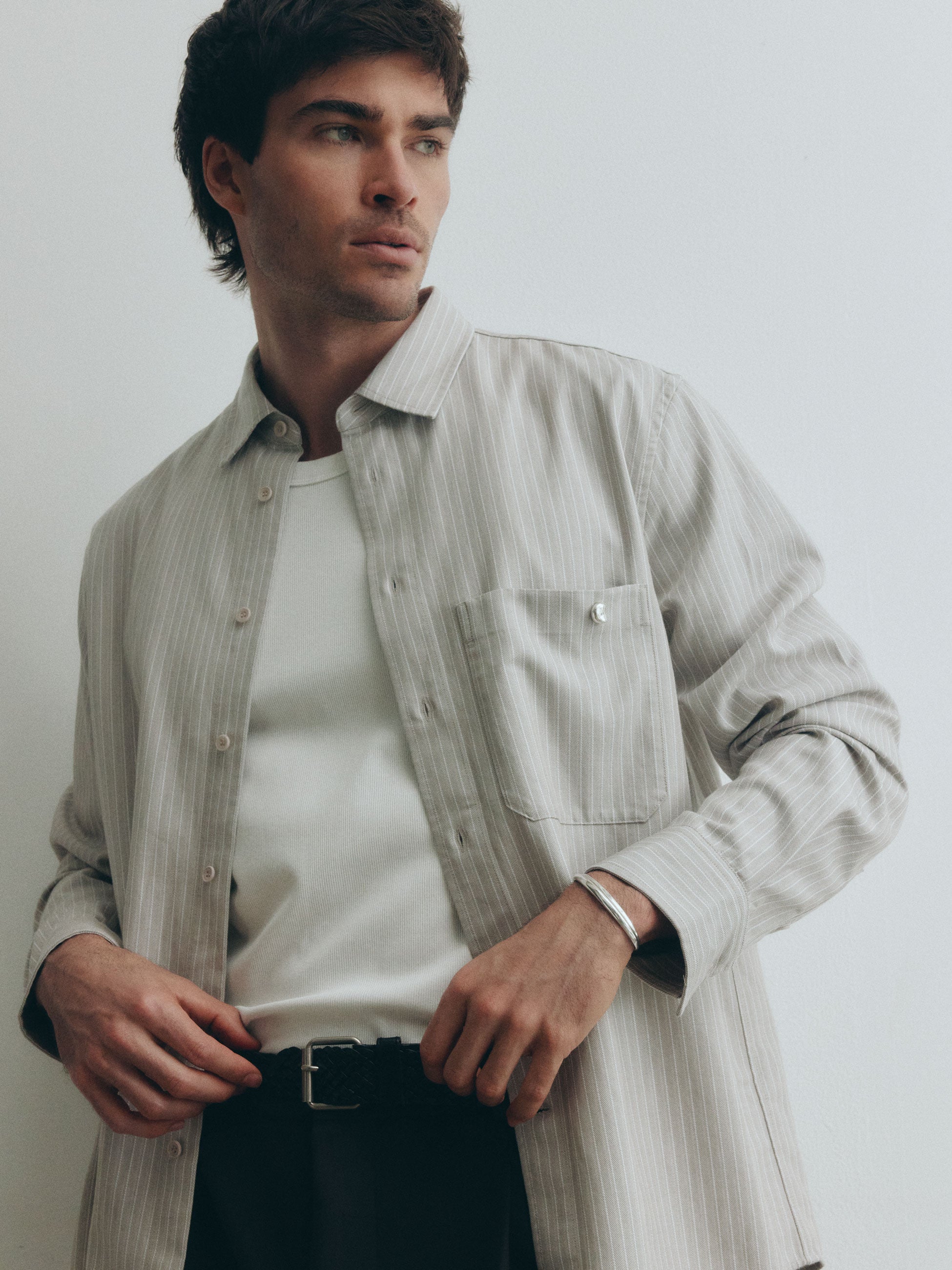 male model posing with .925 sterling silver AGMES cyril thin cuff bracelet on wrist