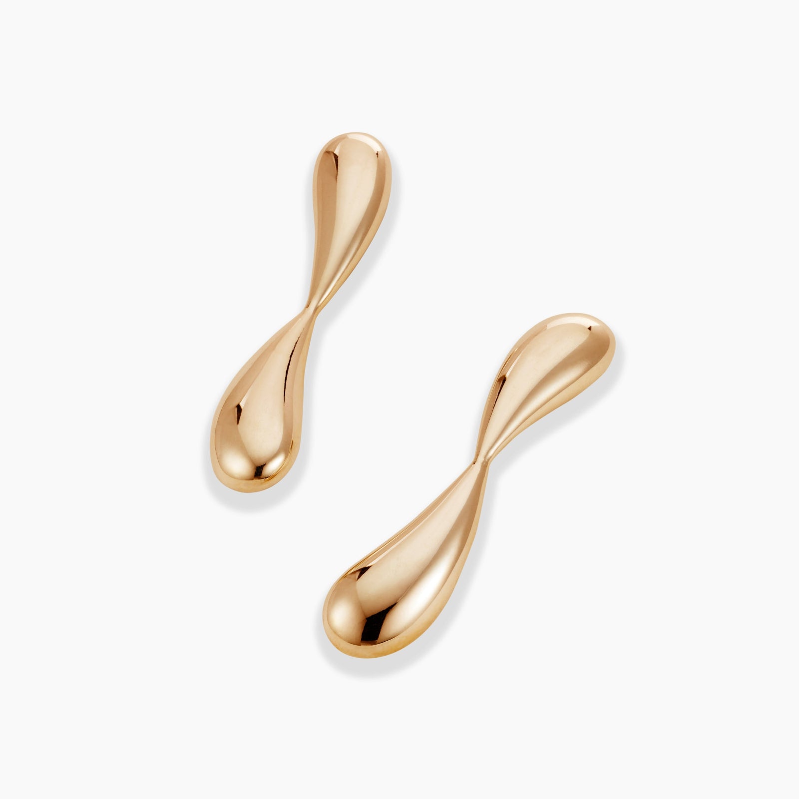 AGMES 18k gold vermeil sculptural infinity Hanneli Earrings on white background.