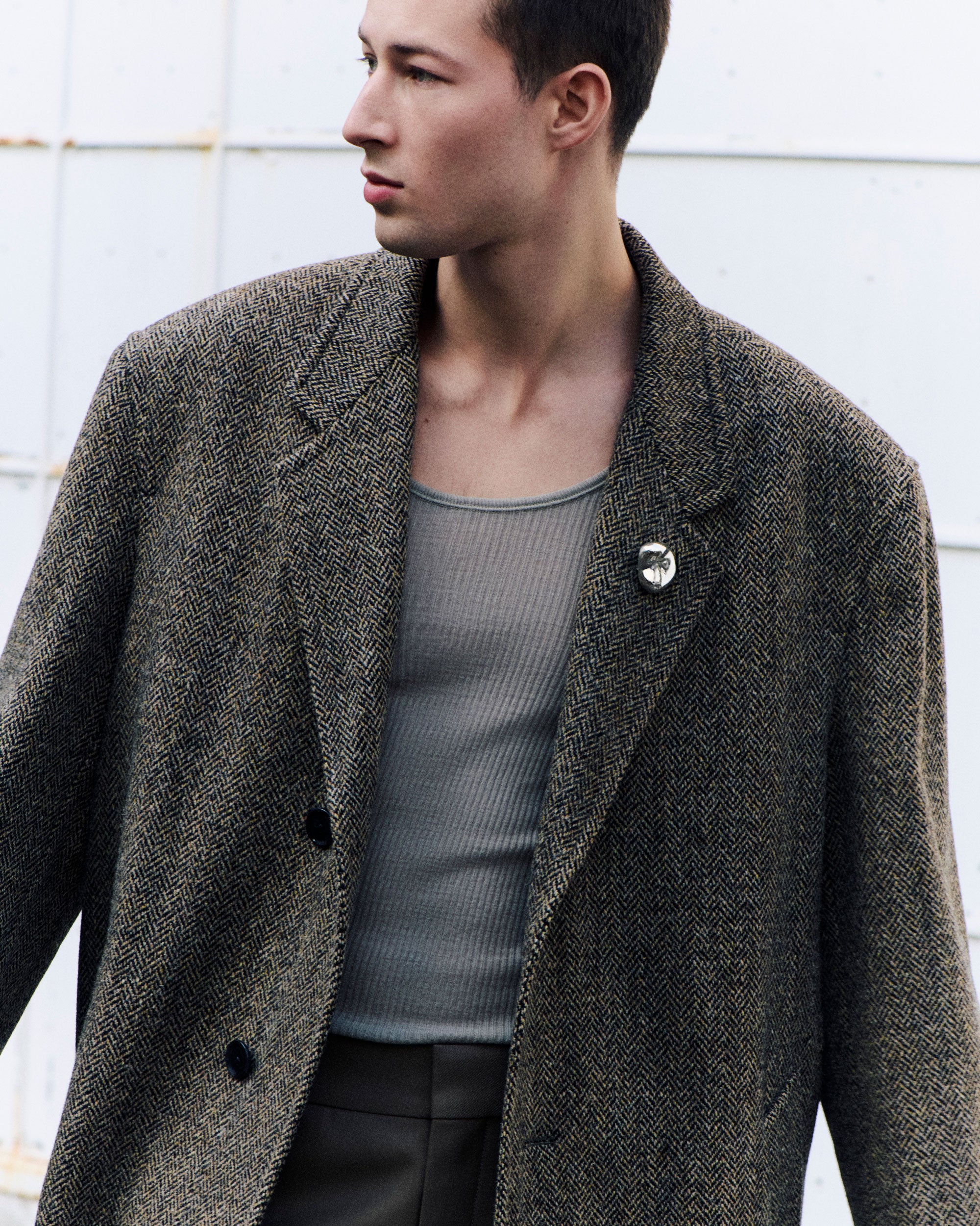 Male model wearing .925 sterling silver AGMES gia brooch