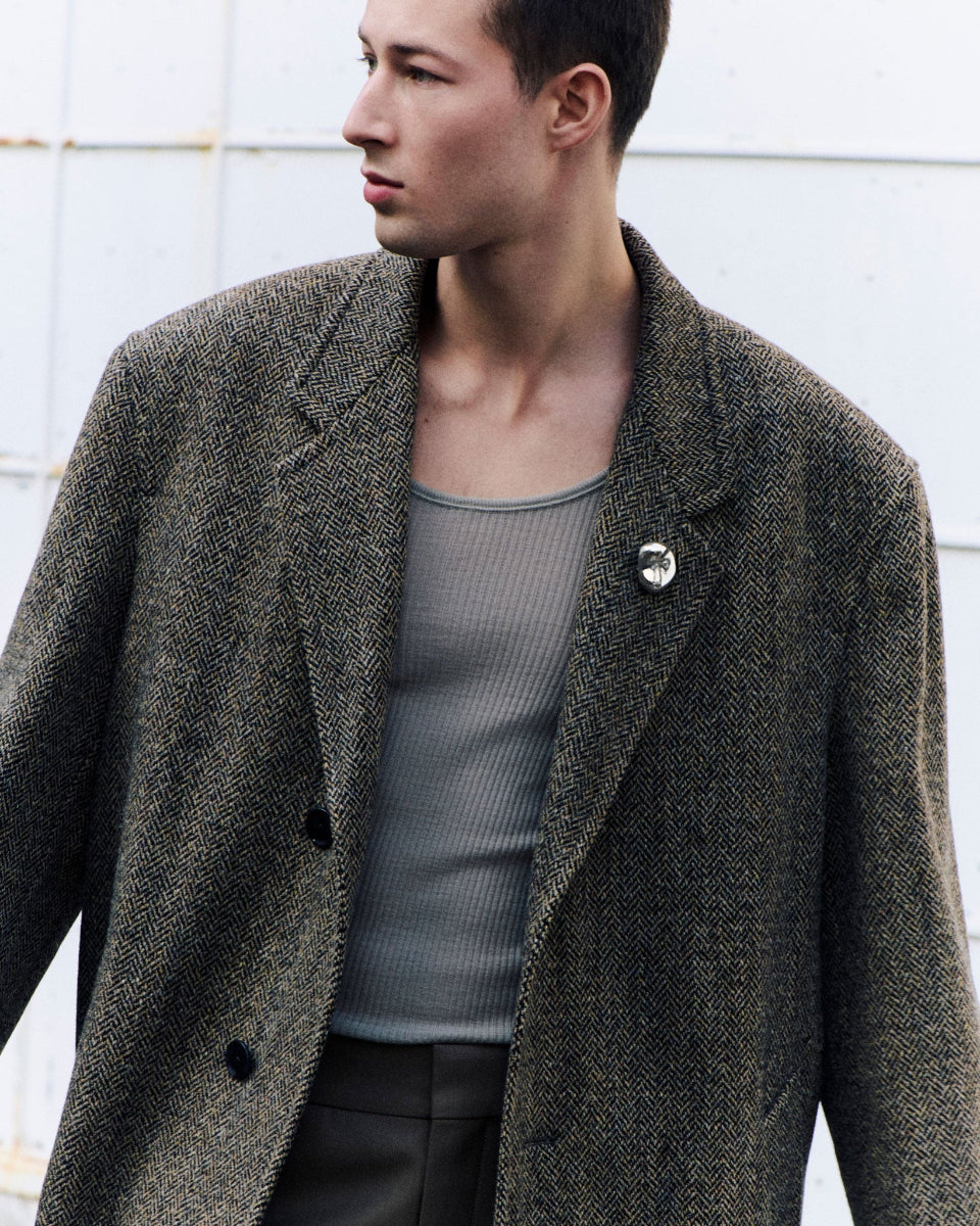 Male model wearing .925 sterling silver AGMES gia brooch