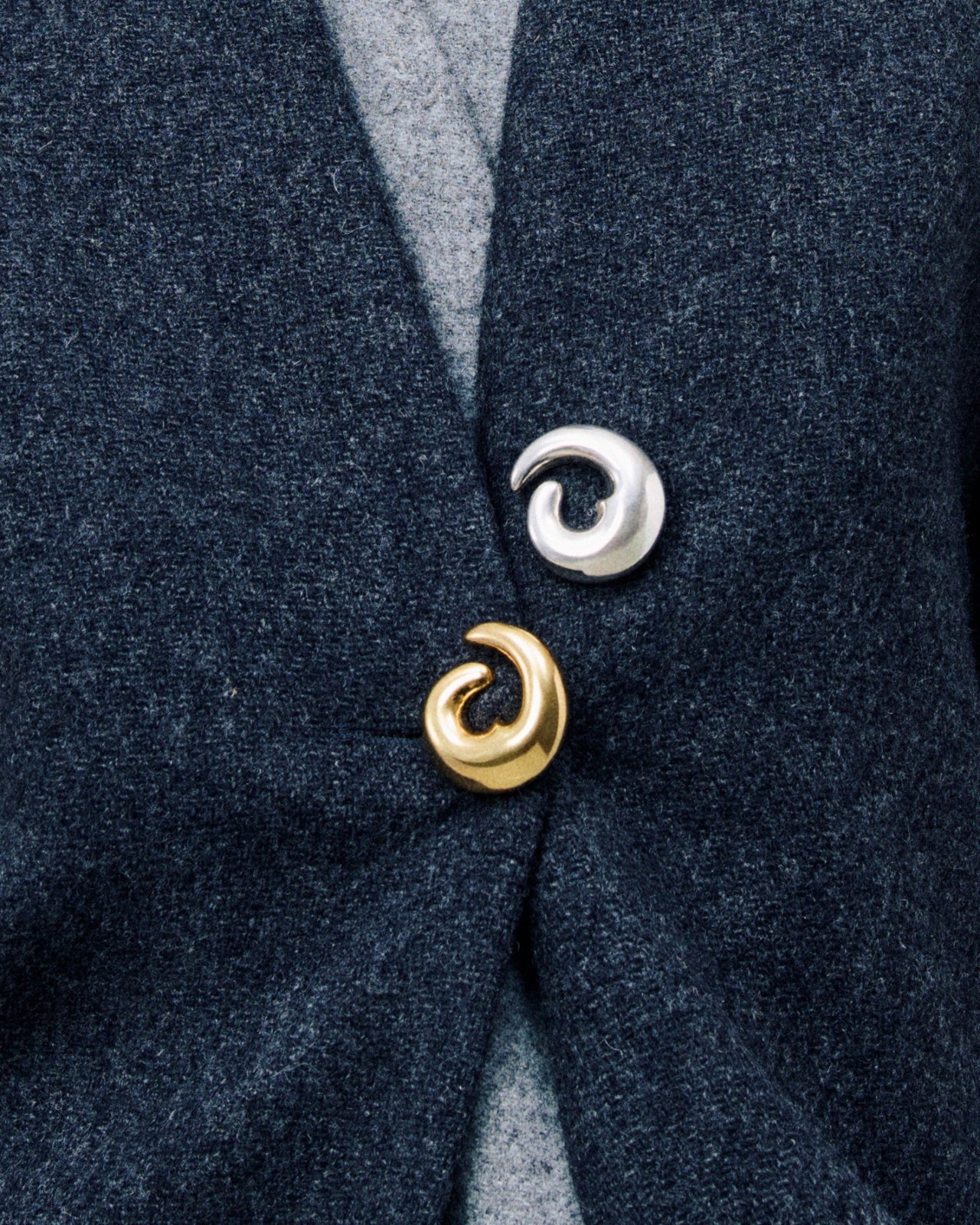 Model wearing AGMES Nadia Brooch in 18k Gold Vermeil and .925 Sterling Silver on cardigan