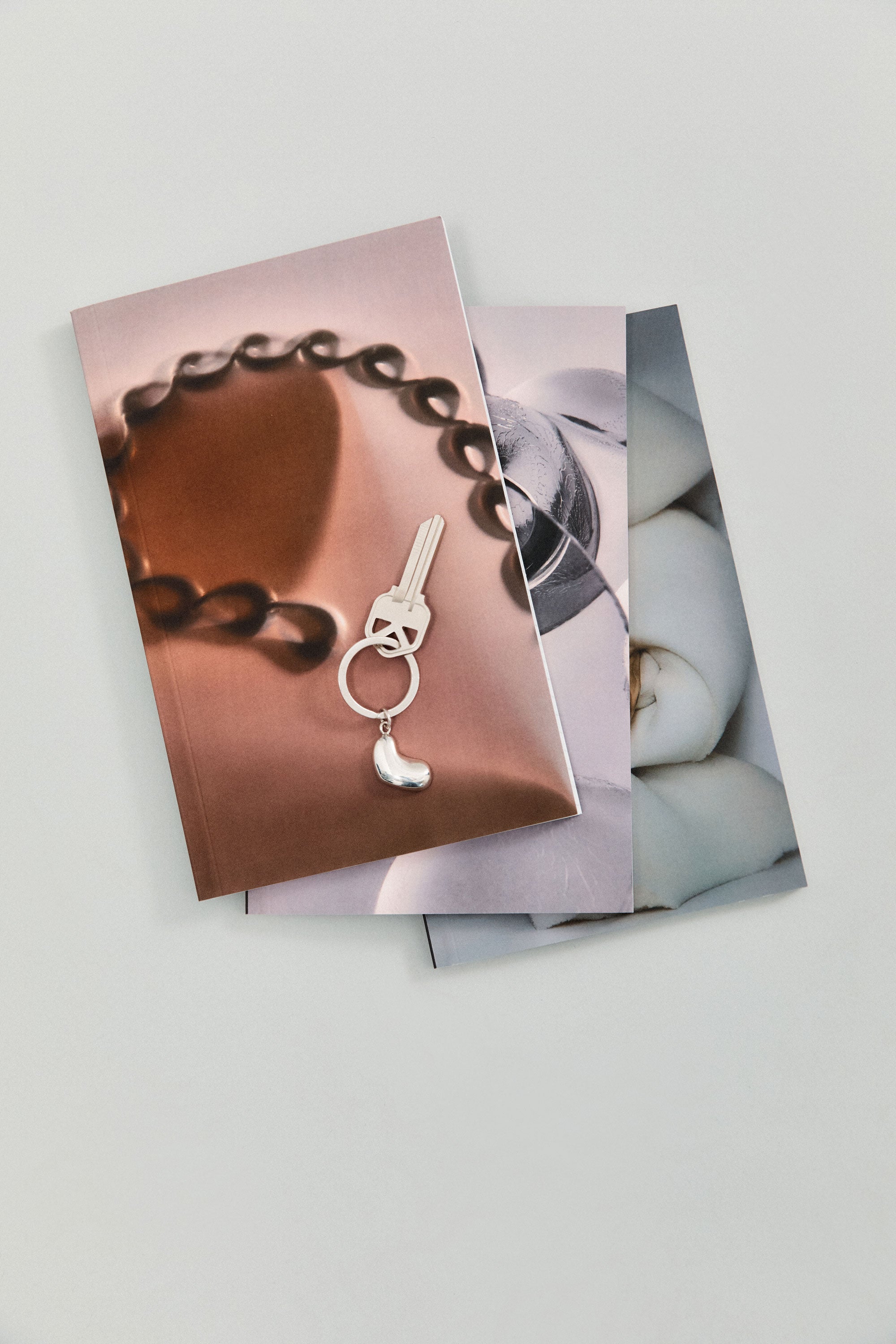 AGMES Small Sculpted Heart Keychain Notebook. 5" x 8" notebook.
Matte scratch resistant soft cover.