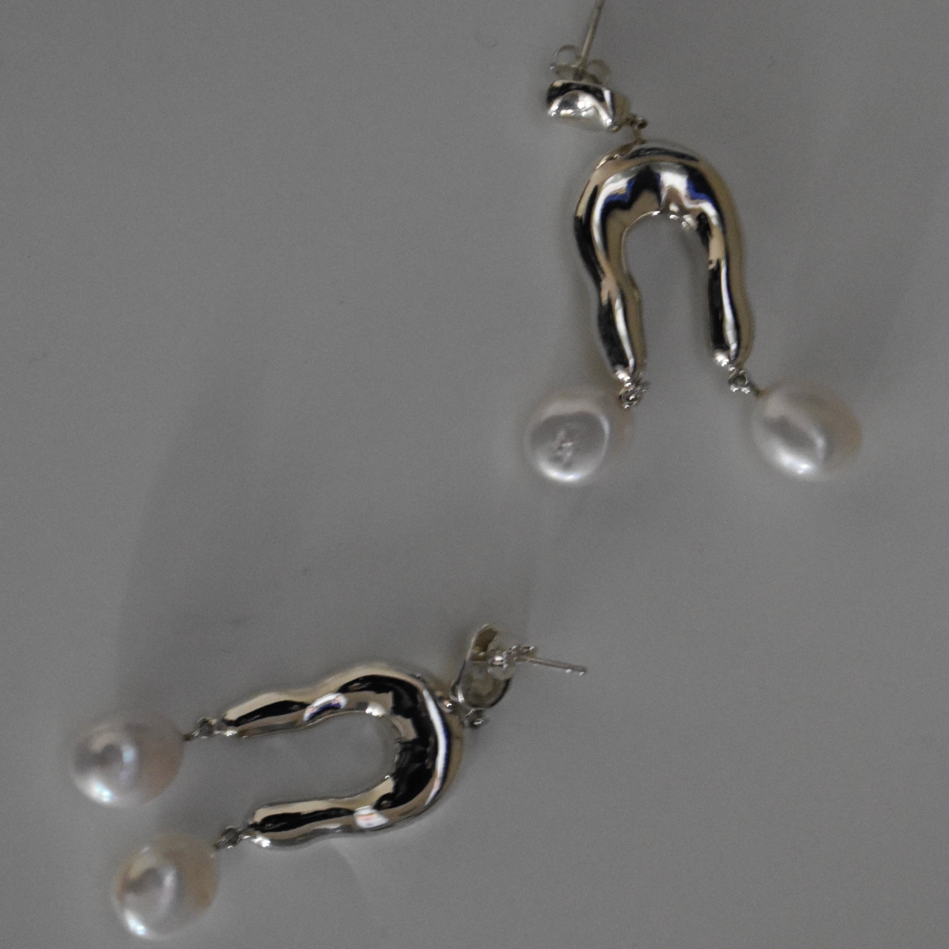 AGMES 0.925 sterling silver earrings with sculpted wishbone and freshwater pearl drop.