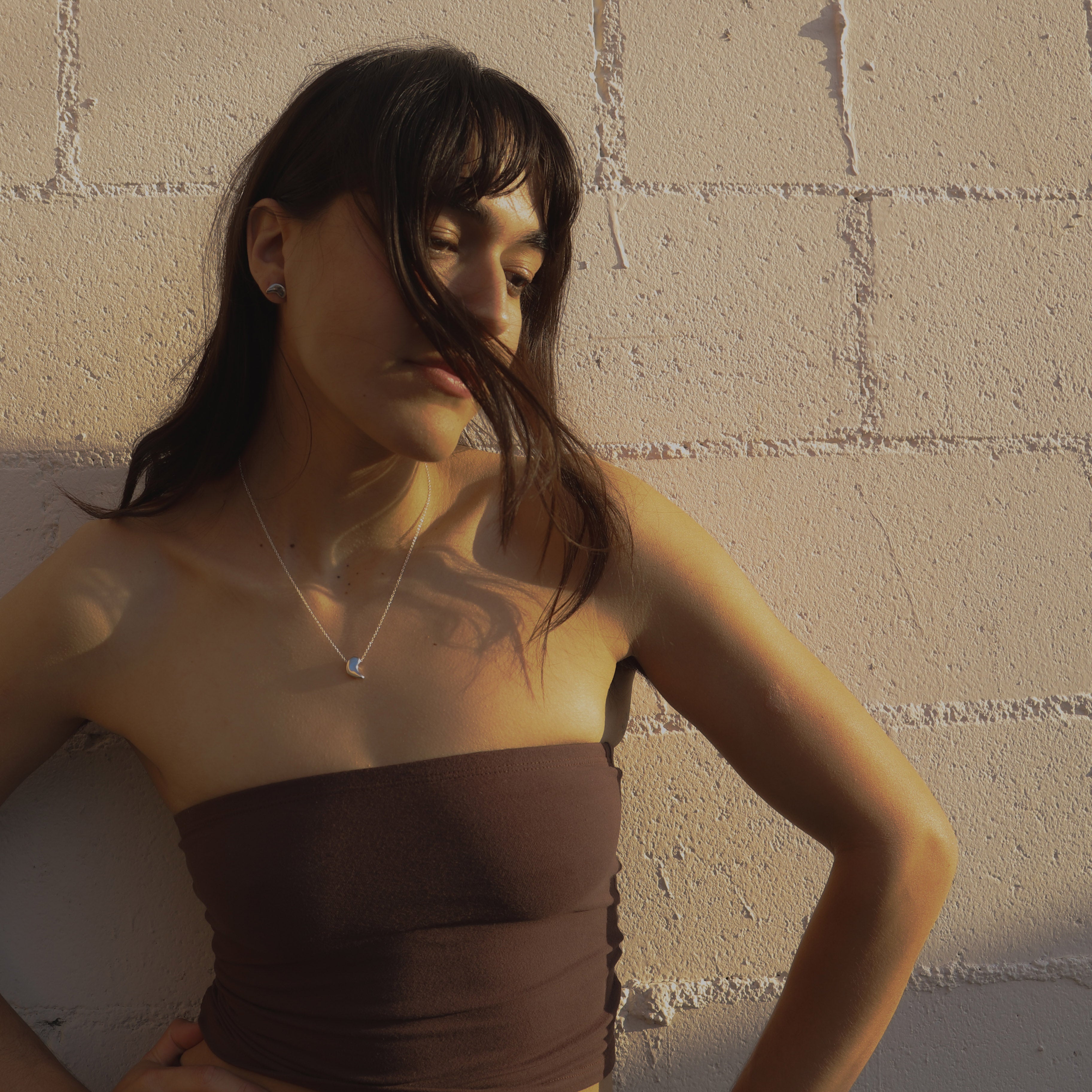 Woman wearing the AGMES .925 Sterling Silver Sum of Parts Pendant.