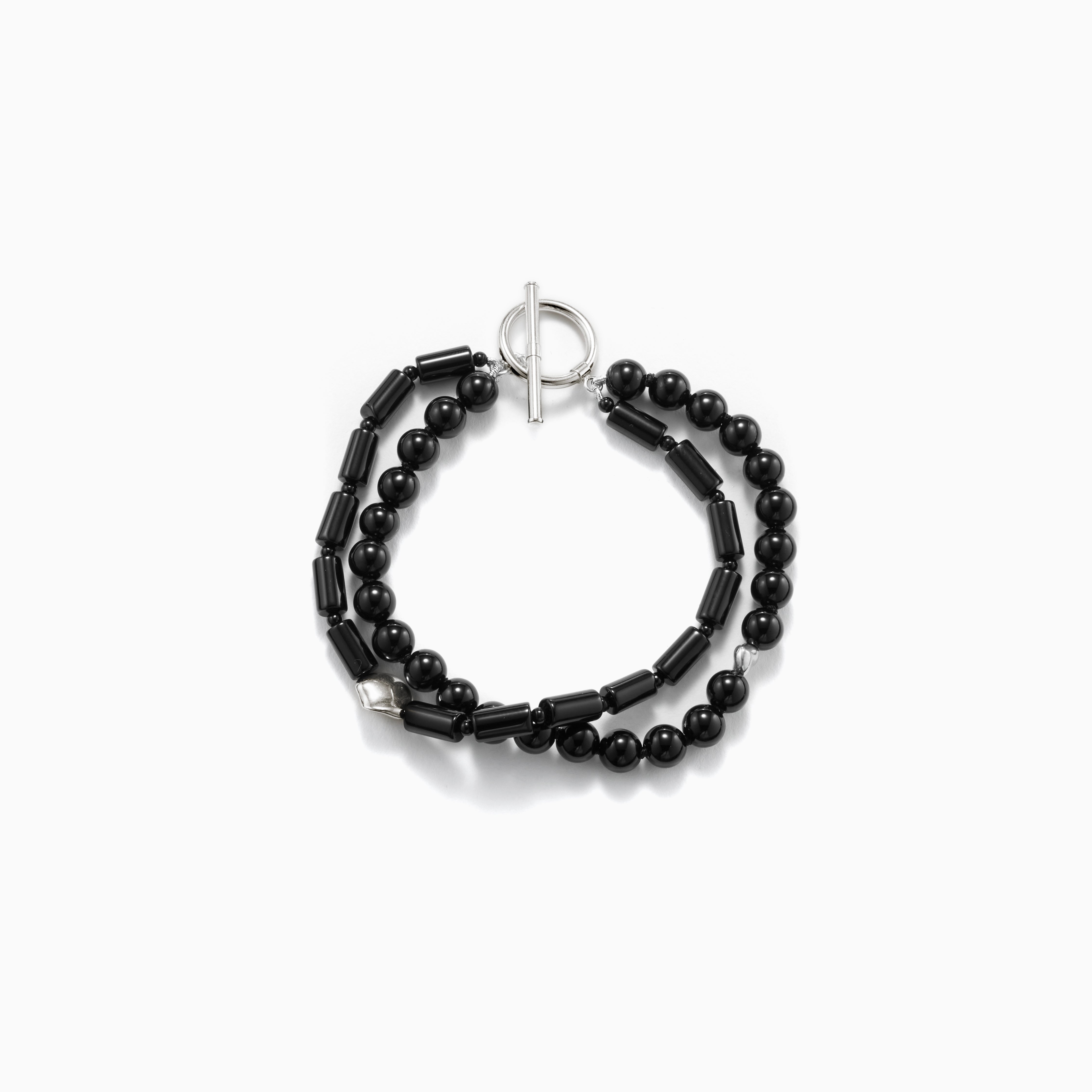 Black onyx double strand beaded bracelet with .925 sterling silver accents on white background
