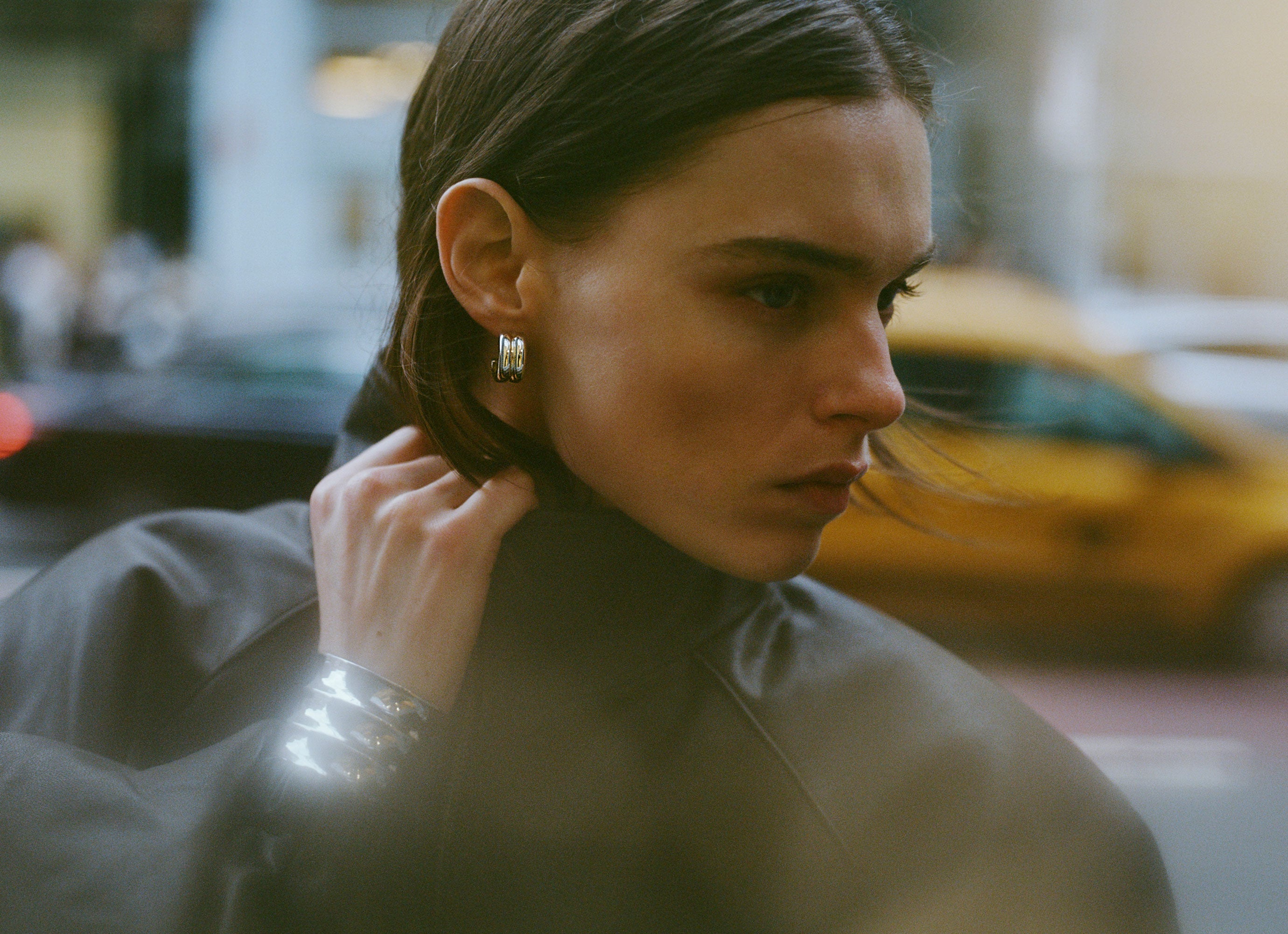 Model wearing .925 sterling silver AGMES Giulia Hoop Earrings and Ridge cuff