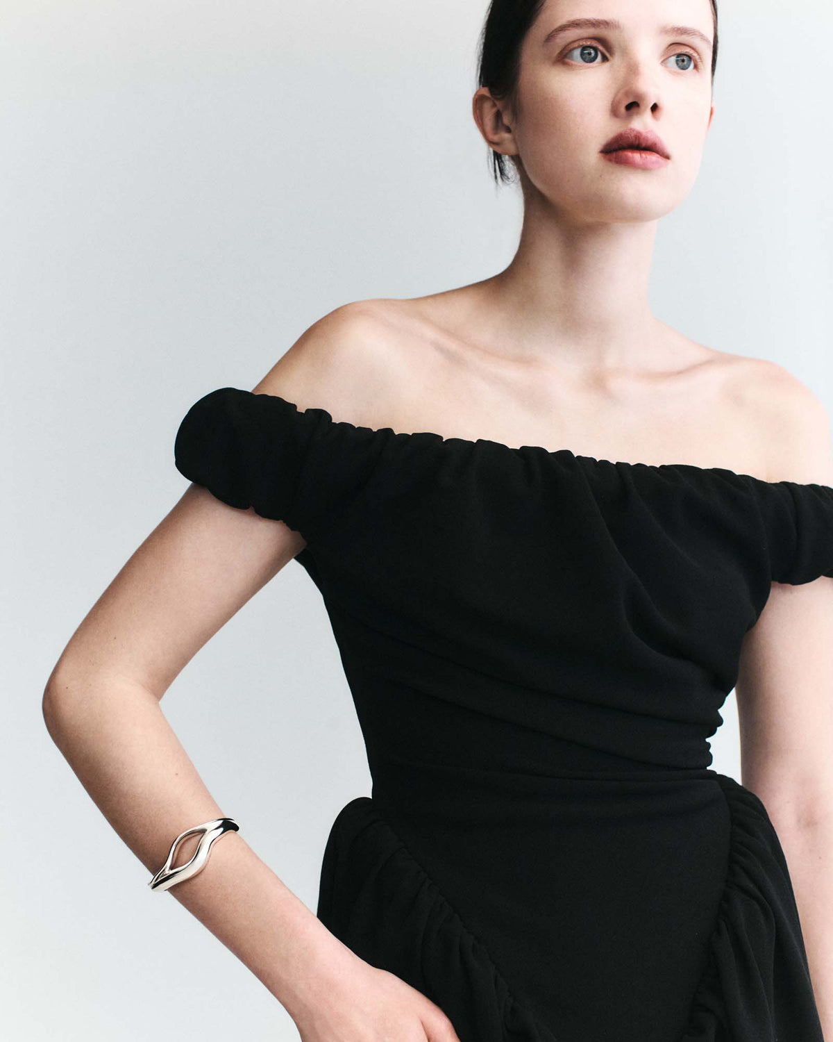 Model wearing .925 sterling silver 2-tiered open cuff bracelet with off-the-shoulder black formal dress
