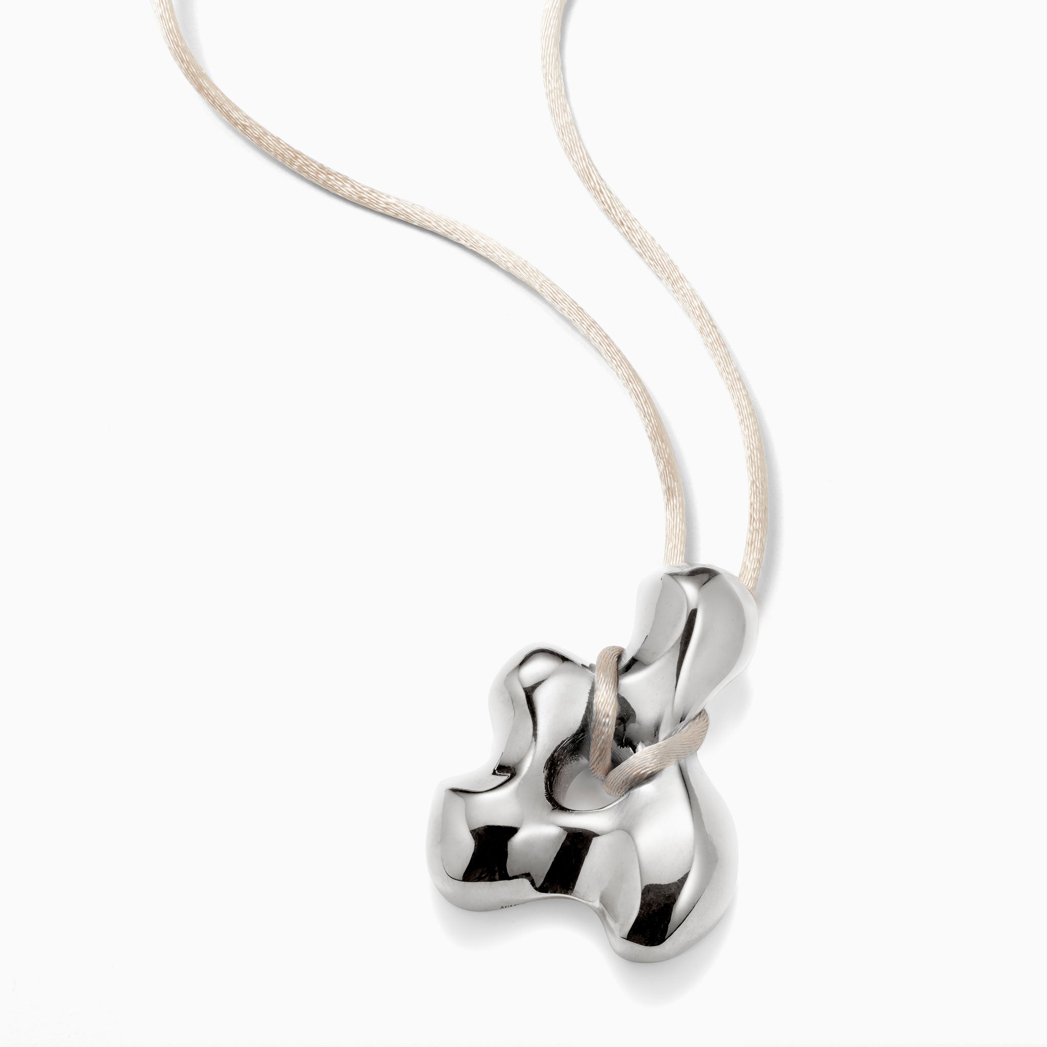 AGMES .925 Sterling Silver sculpted pendant on Ivory satin cord. Simone Bodmer-Turner.