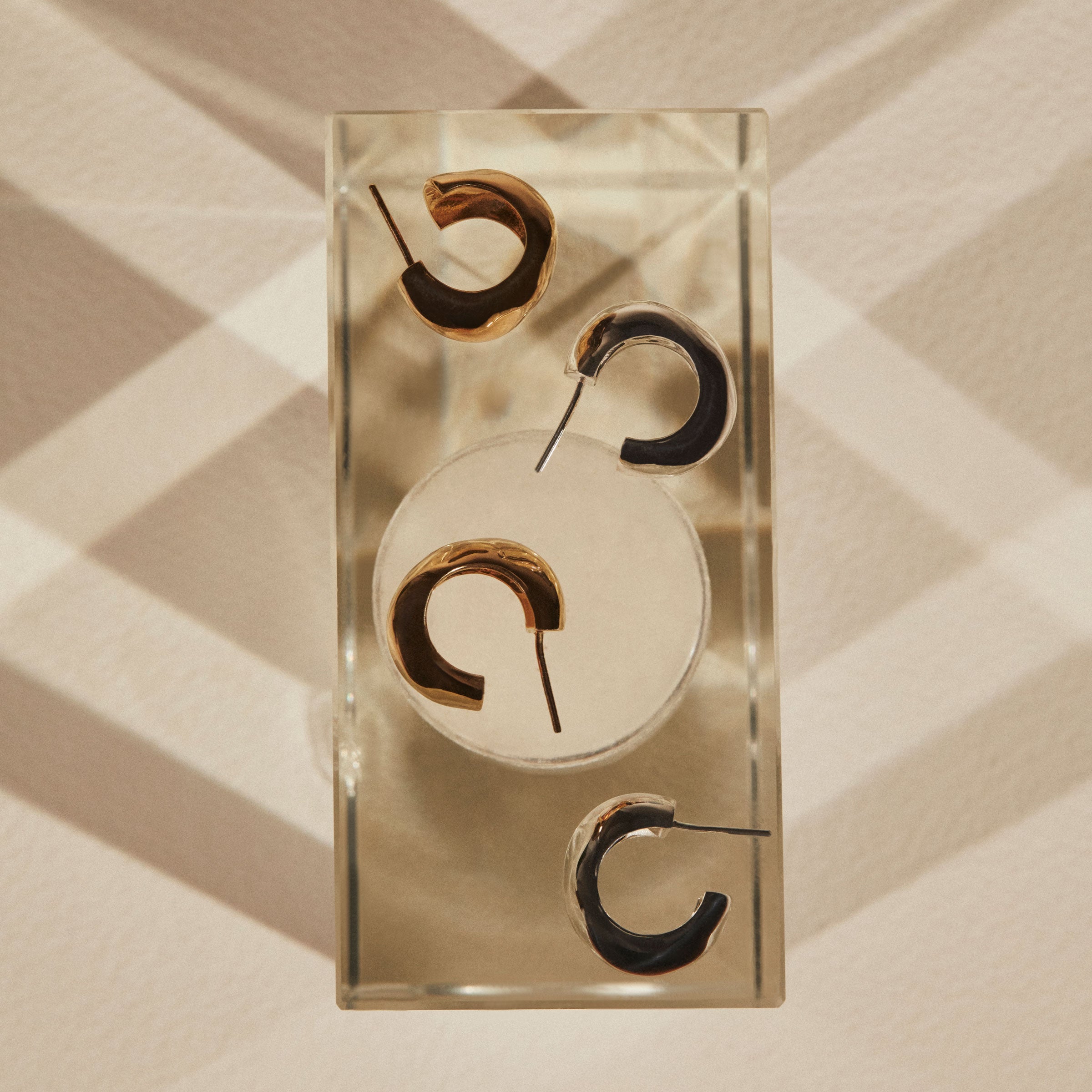 AGMES 0.925 sterling silver and 18k gold vermeil medium hoop earrings.