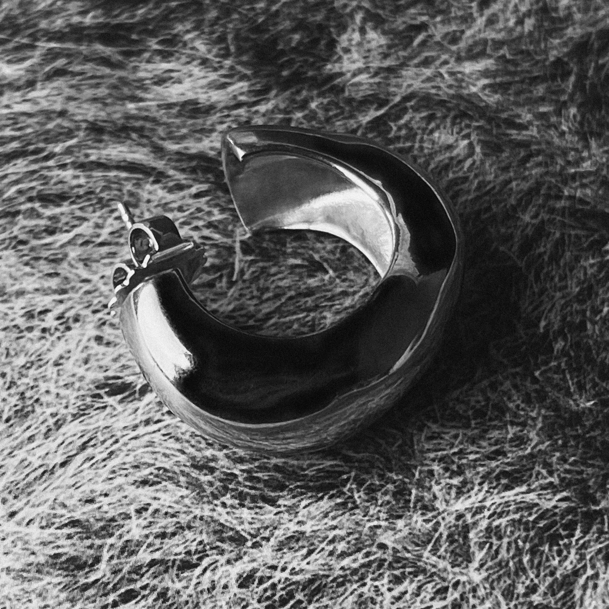 AGMES 0.925 sterling silver medium hoop earrings.