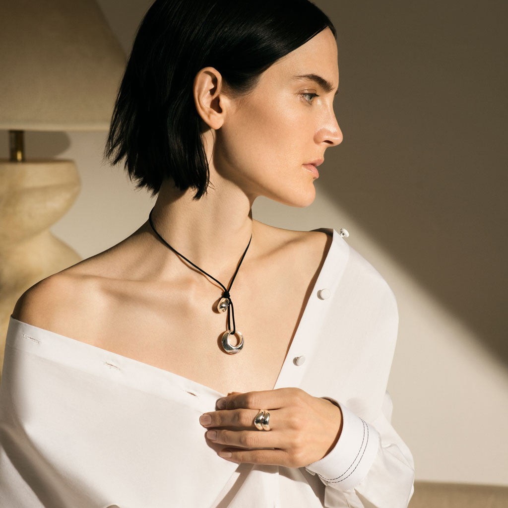 Woman wearing AGMES .925 Sterling Silver Double Wave Ring.