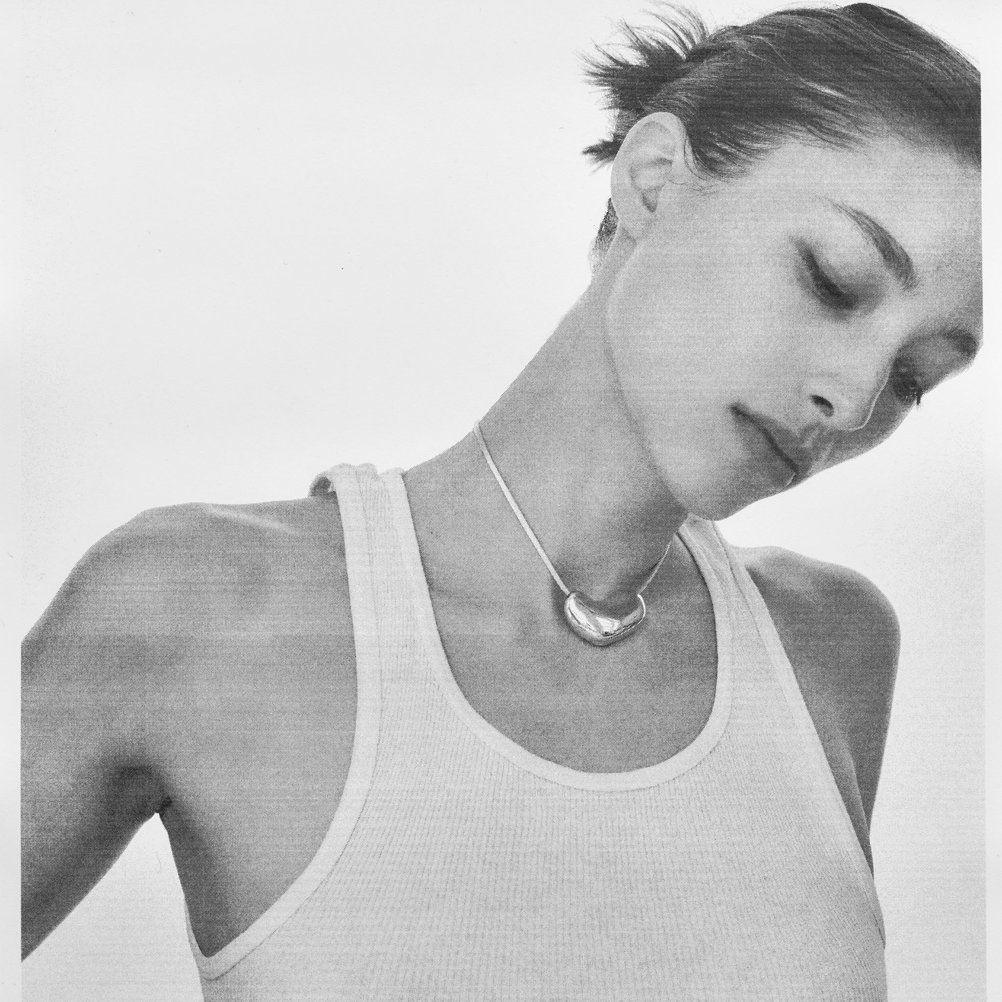 AGMES .925 Sterling Silver Sculpted Heart Pendant on Ivory Satin Cord.