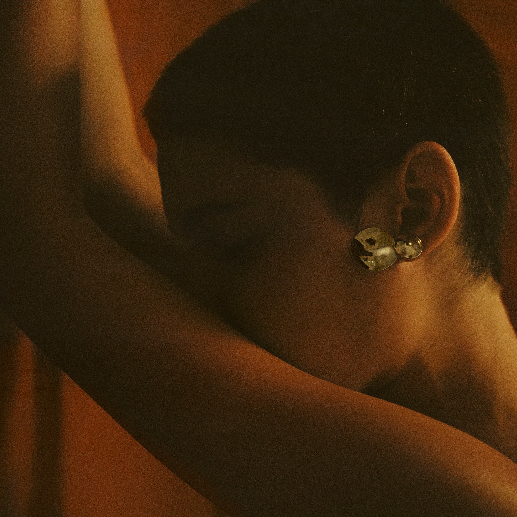 Woman wearing AGMES 0.925 sterling silver short circular round drop earrings.