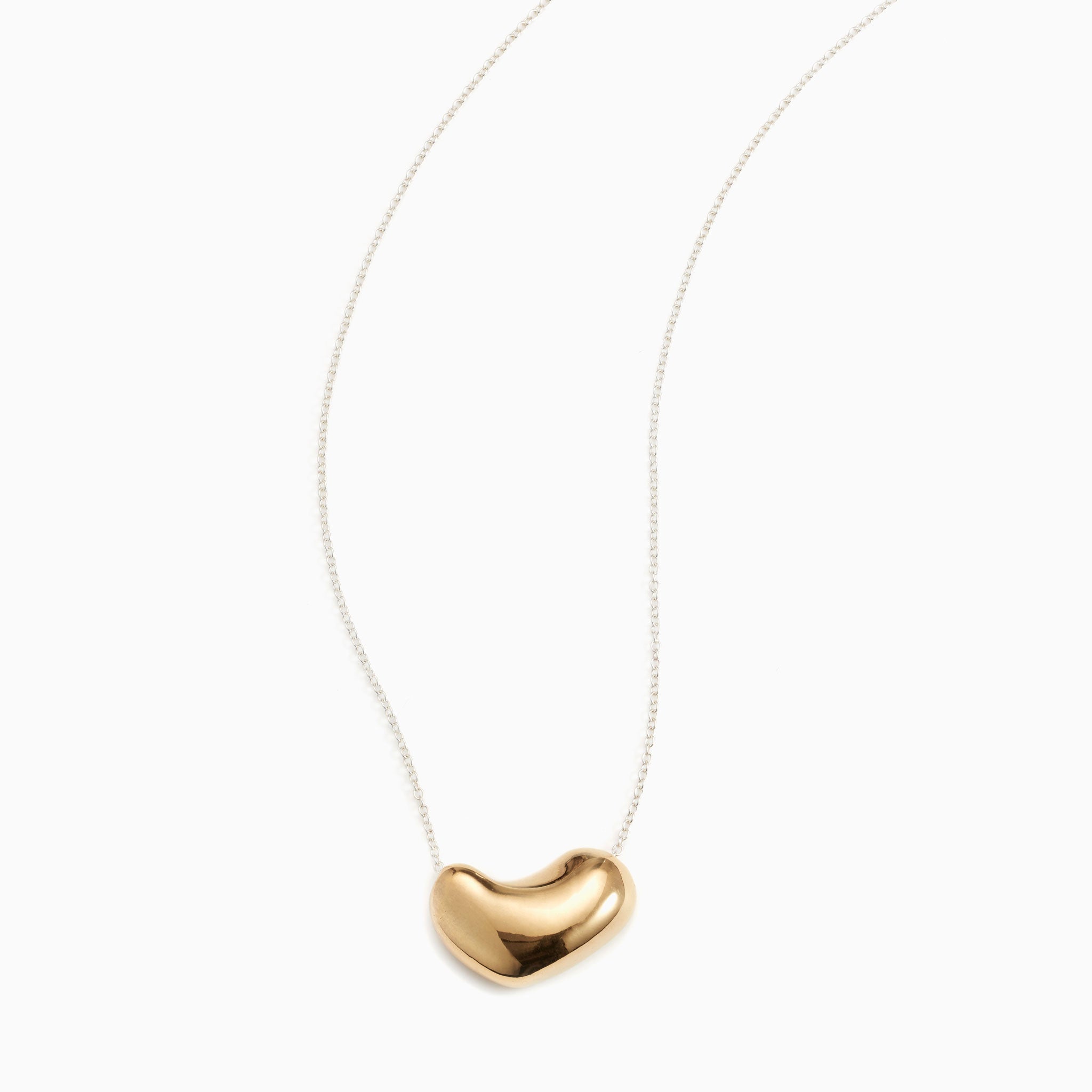 AGMES 18K Gold Vermeil Small Sculpted Heart Pendant on Sterling Silver Chain Necklace on white background.