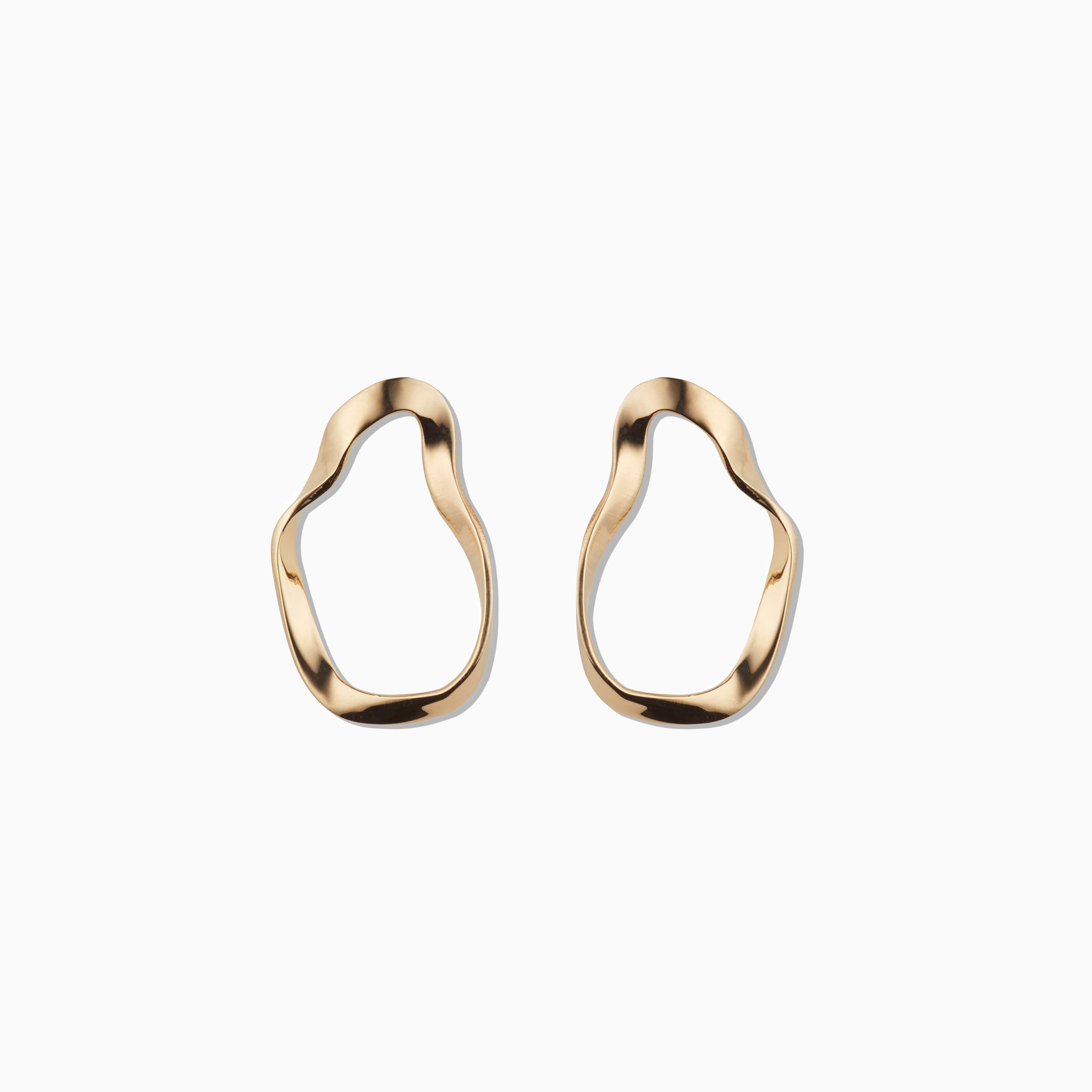 AGMES 18k gold vermeil sculptural wavy small round hoop earrings.