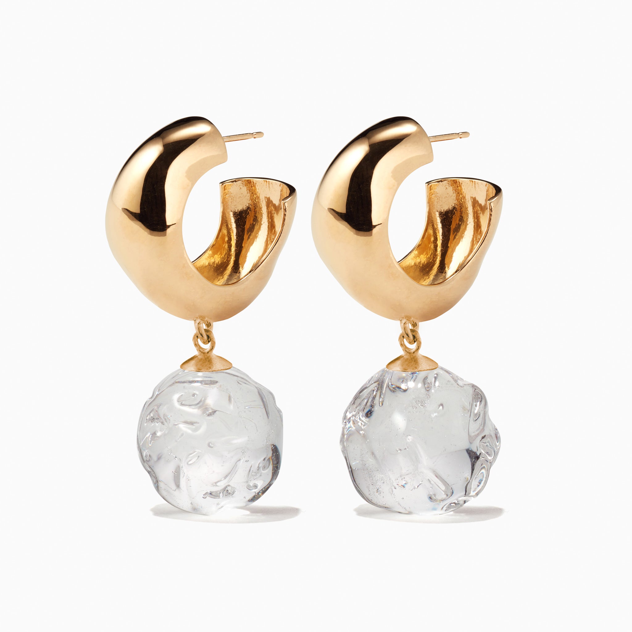 AGMES yellow gold vermeil small Cleo hoop earrings with clear glass bead drop on white background.